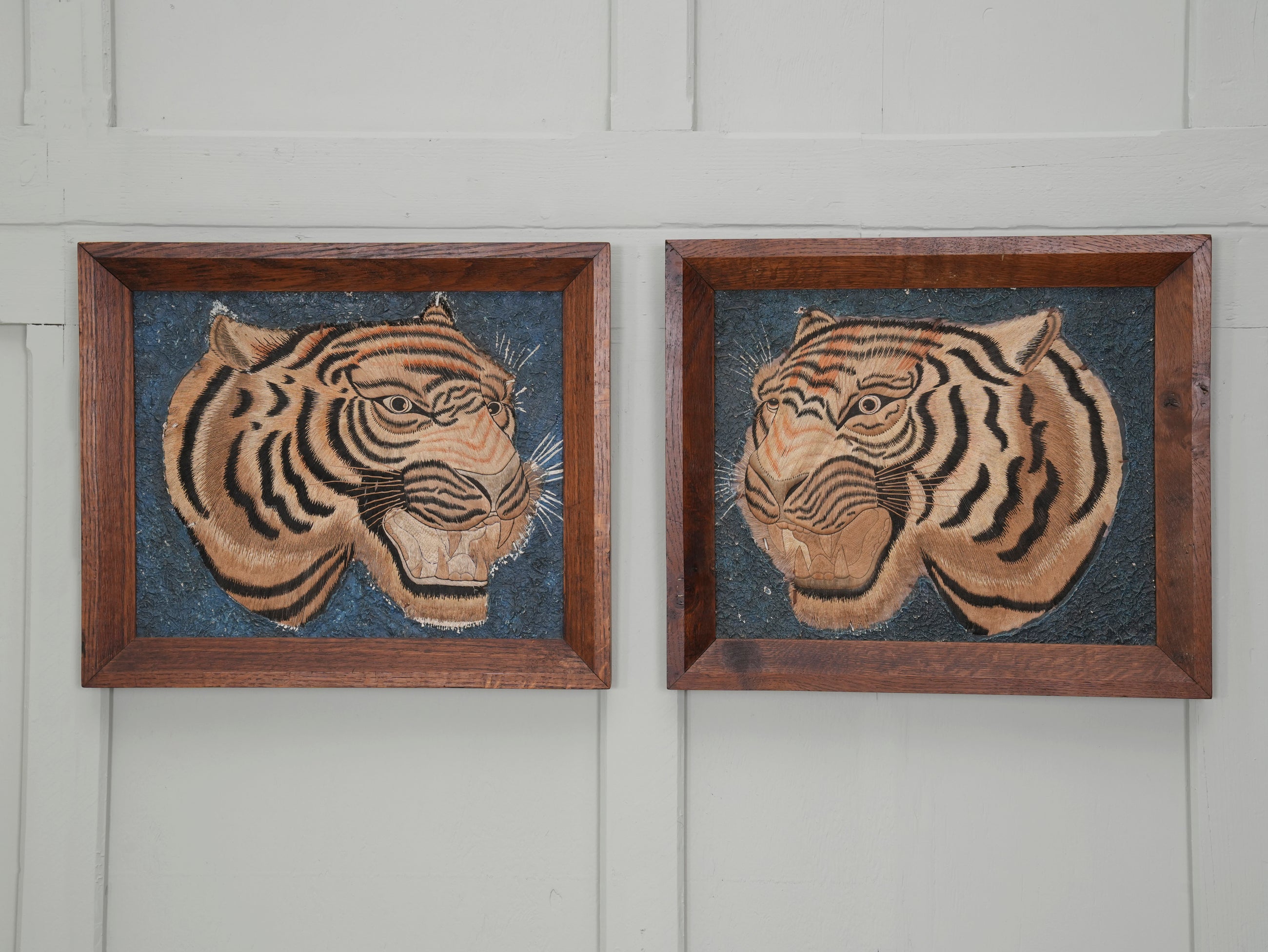 A Pair of Framed Silk Embroideries of Tigers Heads