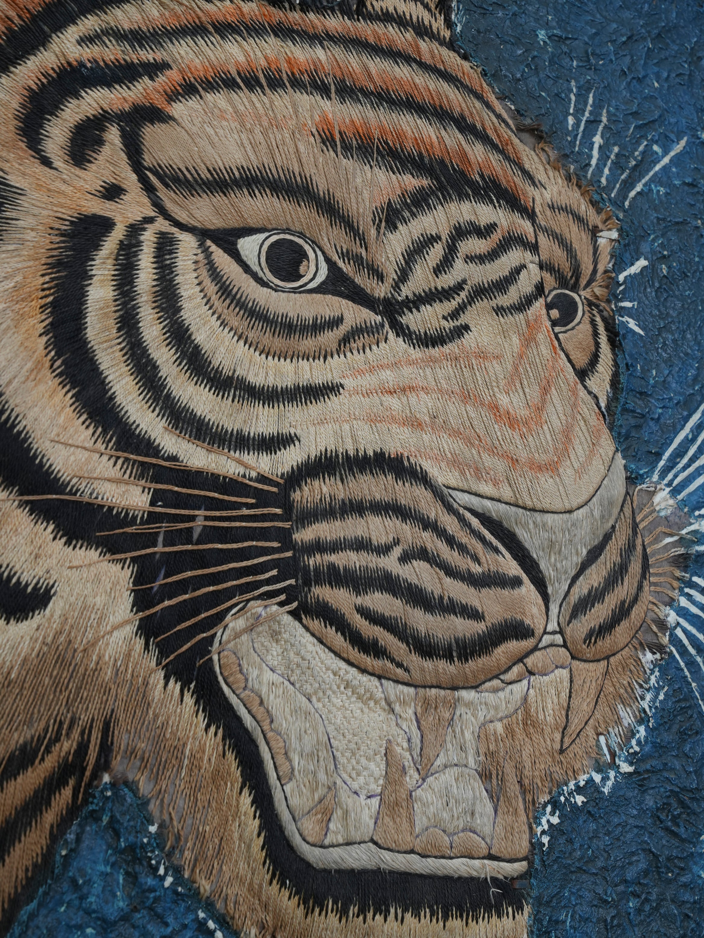 A Pair of Framed Silk Embroideries of Tigers Heads