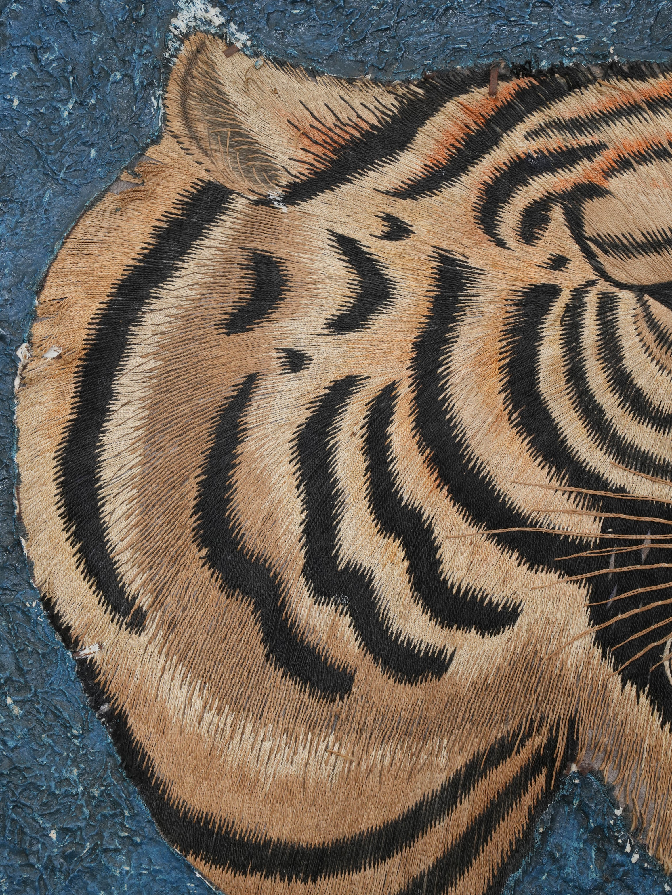A Pair of Framed Silk Embroideries of Tigers Heads