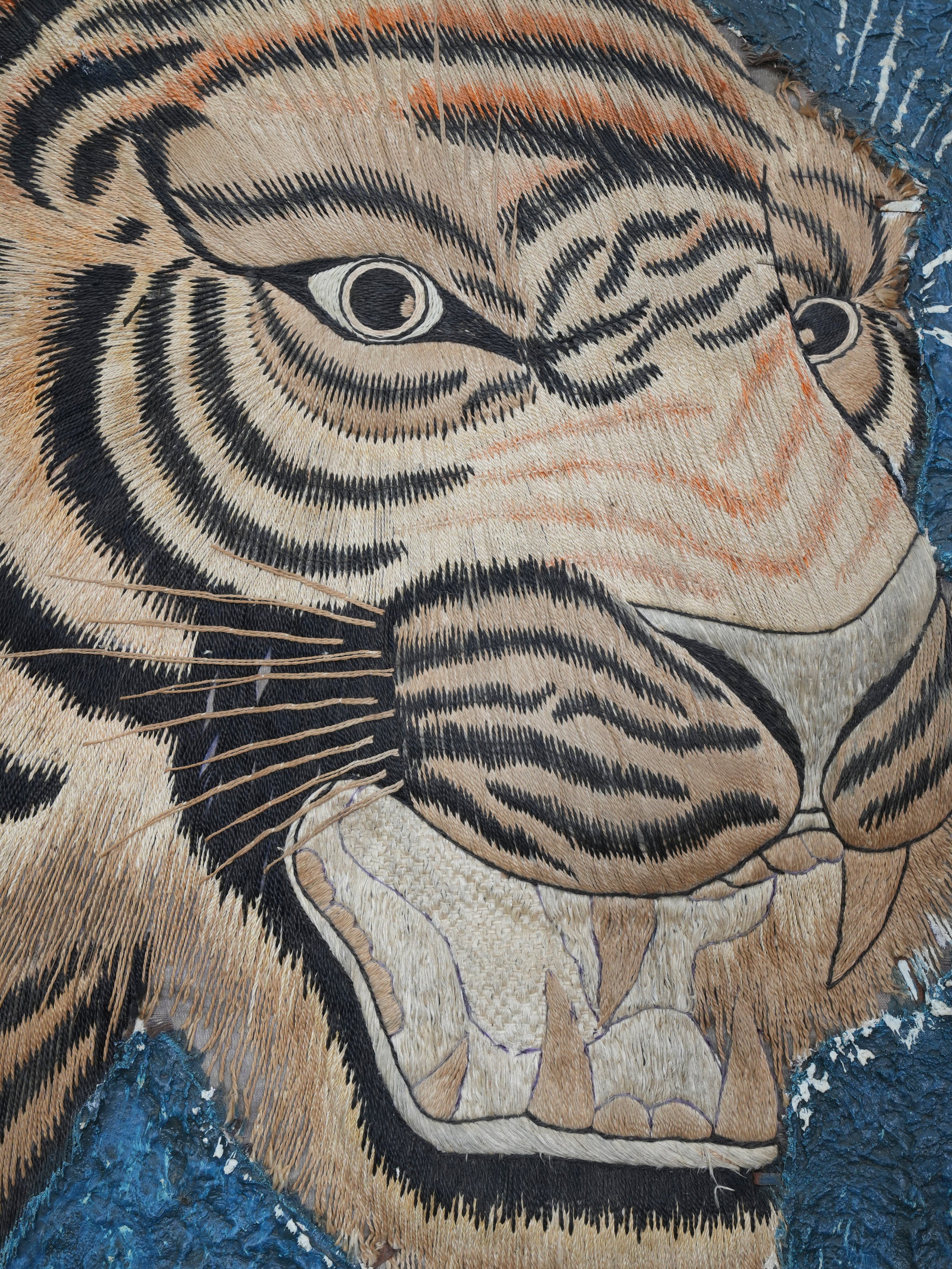 A Pair of Framed Silk Embroideries of Tigers Heads