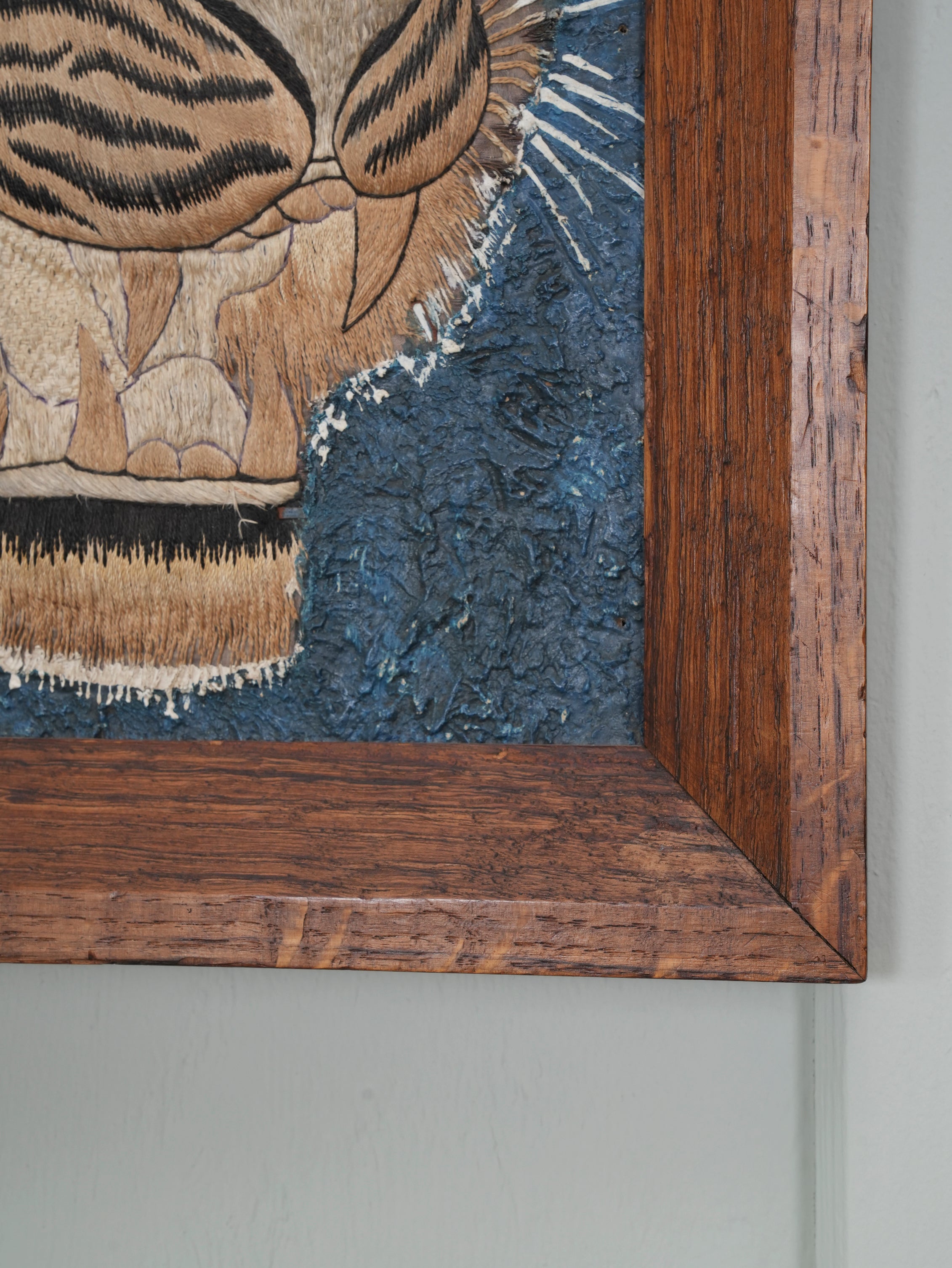 A Pair of Framed Silk Embroideries of Tigers Heads