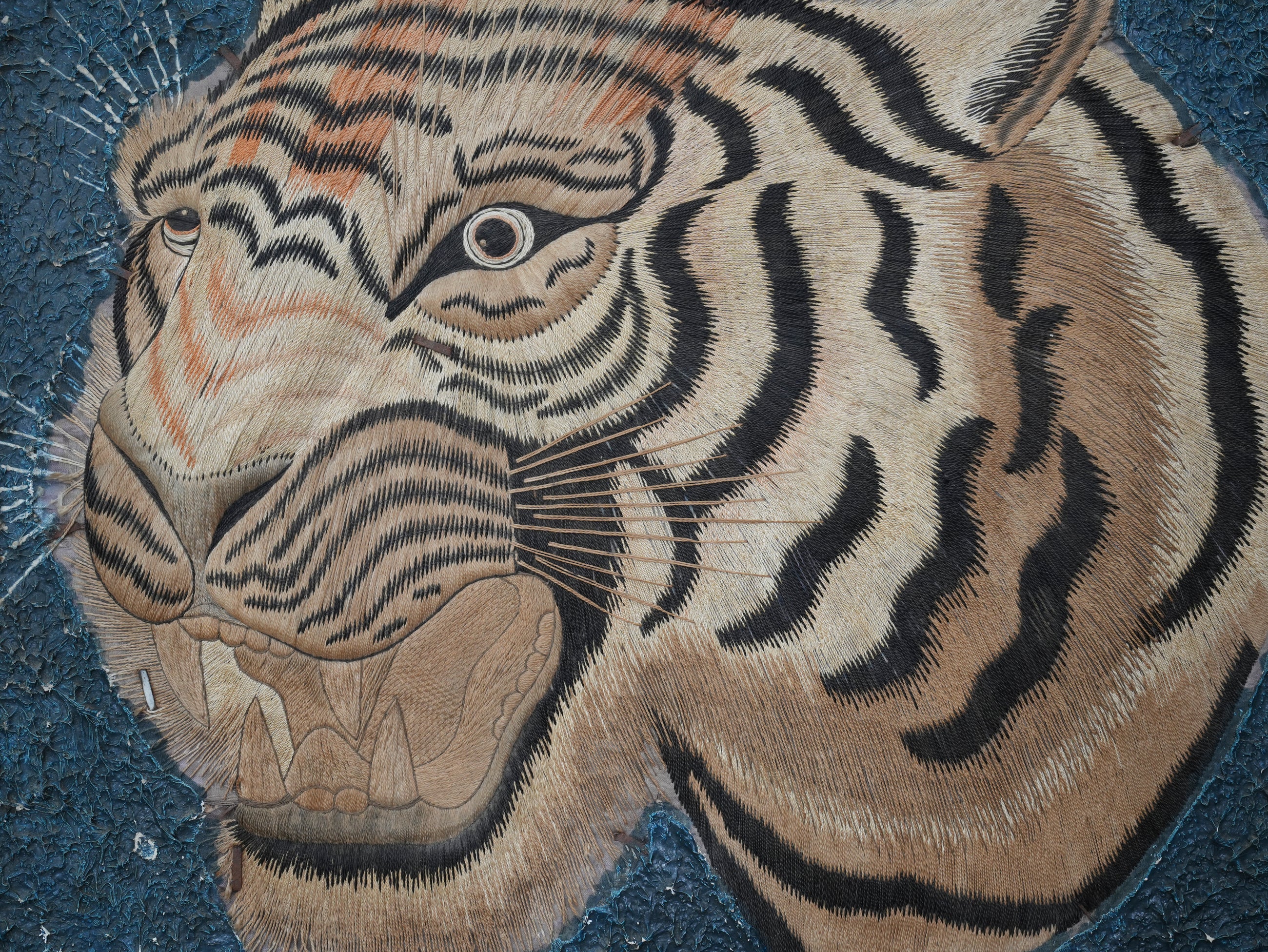 A Pair of Framed Silk Embroideries of Tigers Heads