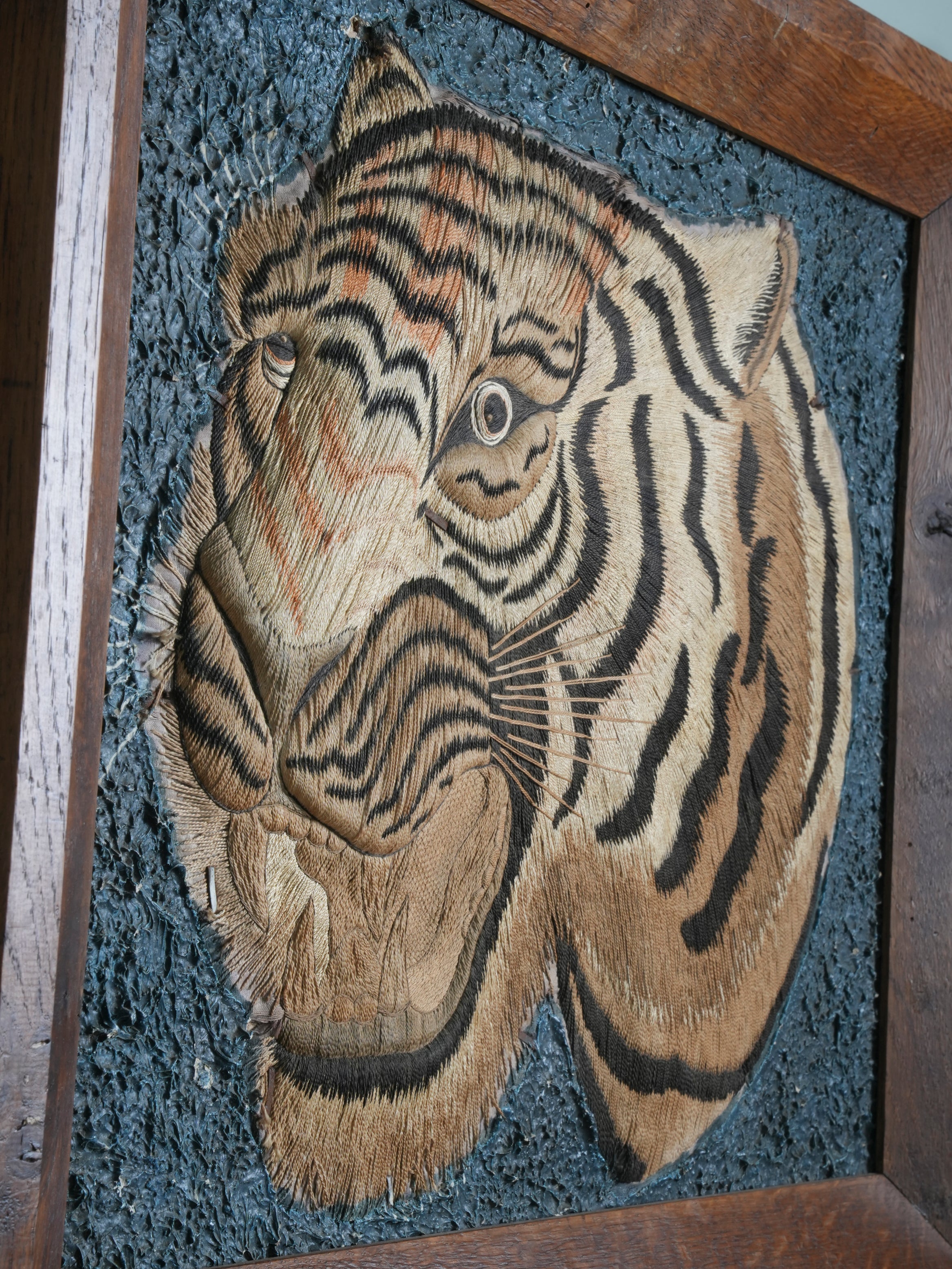 A Pair of Framed Silk Embroideries of Tigers Heads