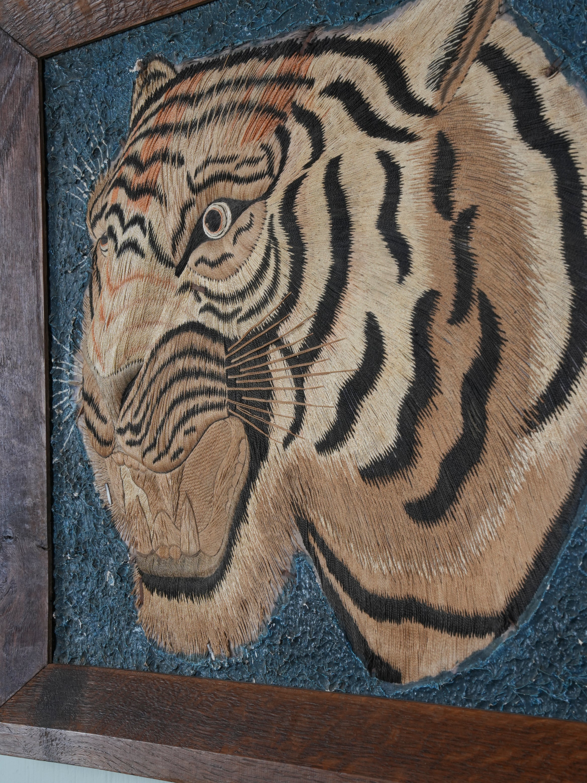 A Pair of Framed Silk Embroideries of Tigers Heads
