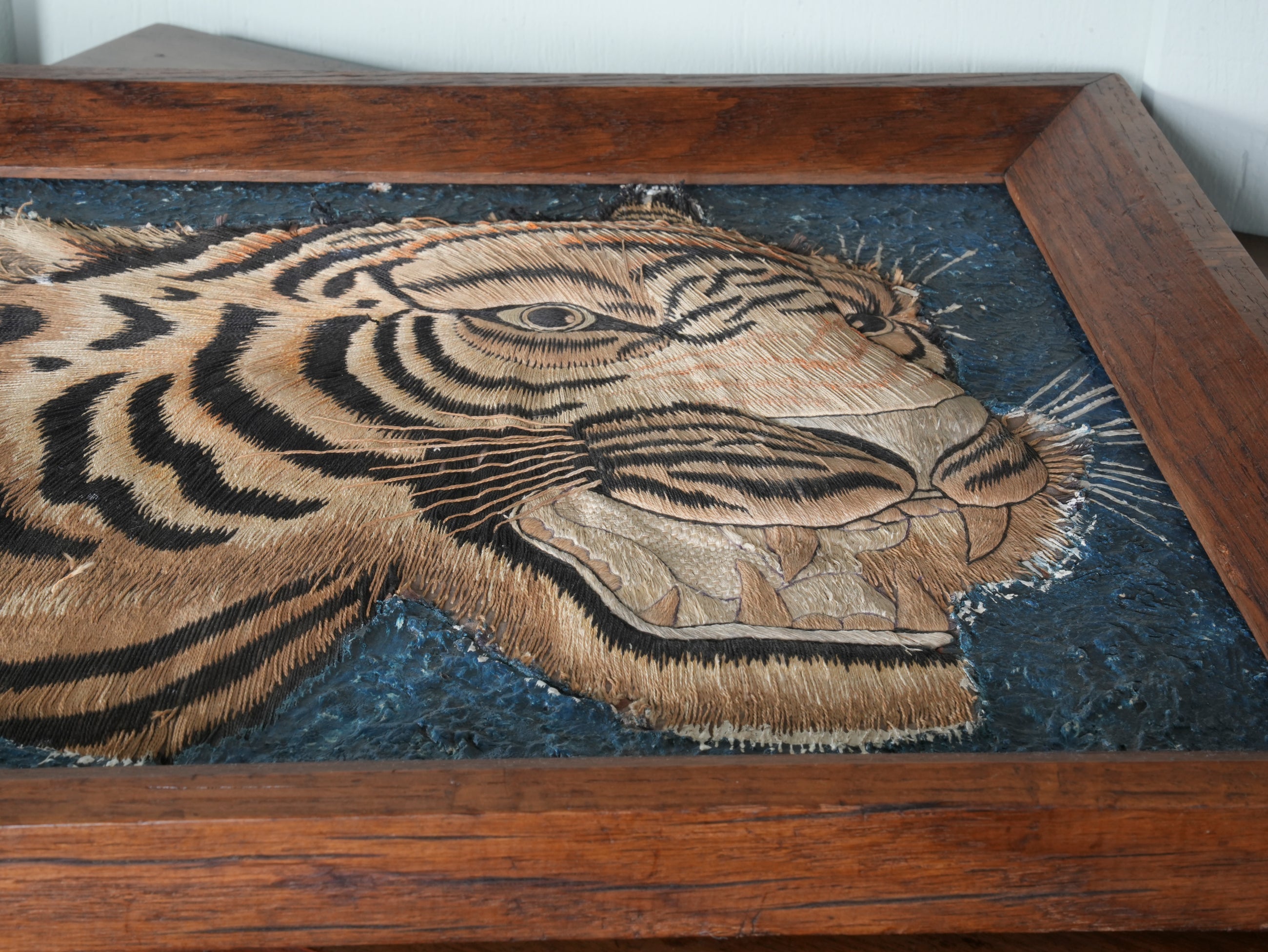 A Pair of Framed Silk Embroideries of Tigers Heads