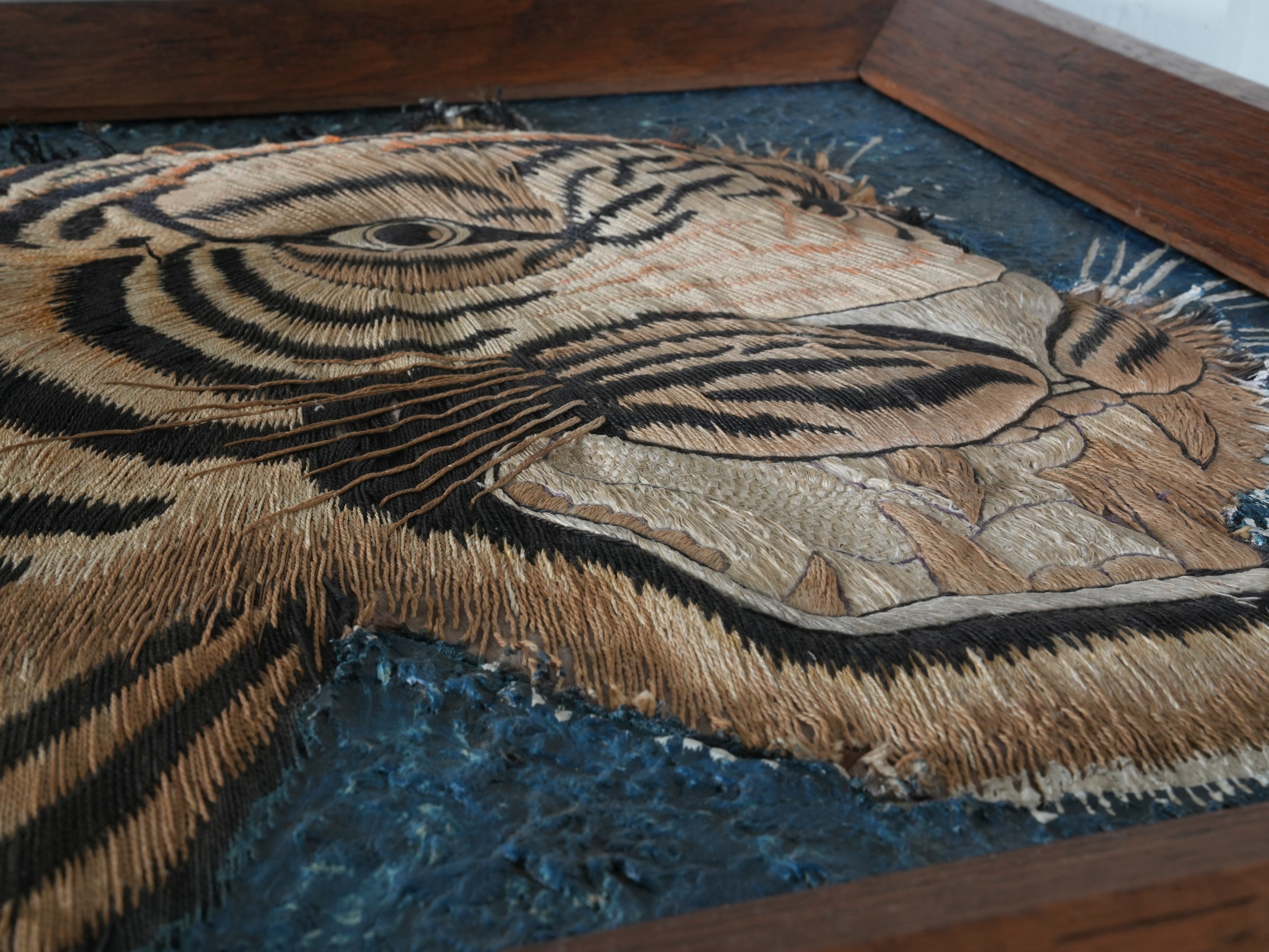 A Pair of Framed Silk Embroideries of Tigers Heads