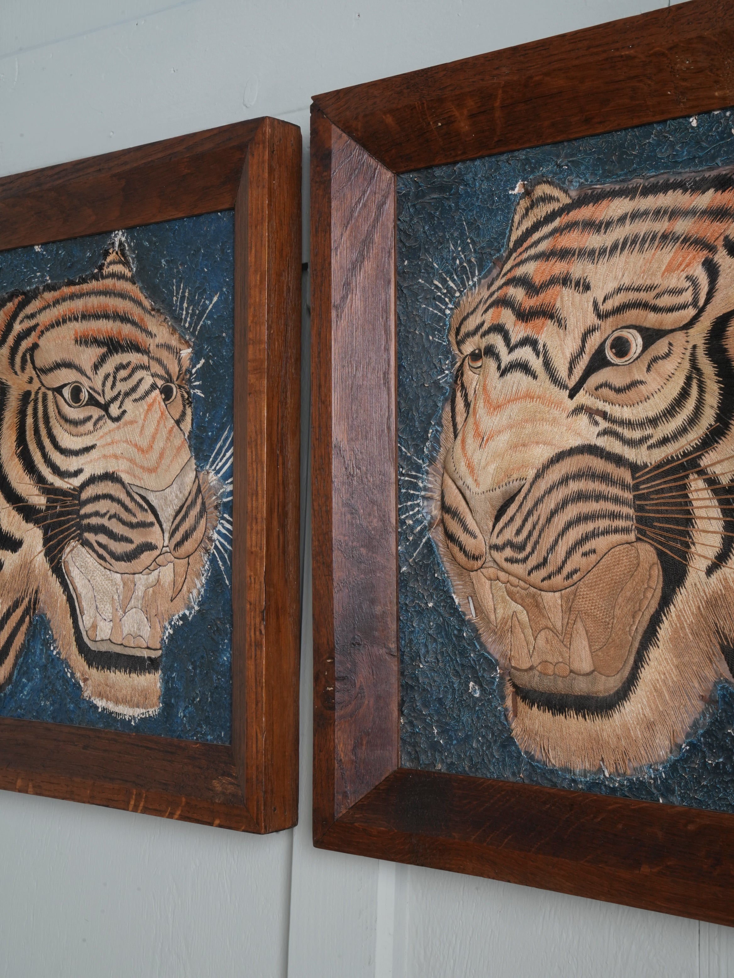 A Pair of Framed Silk Embroideries of Tigers Heads