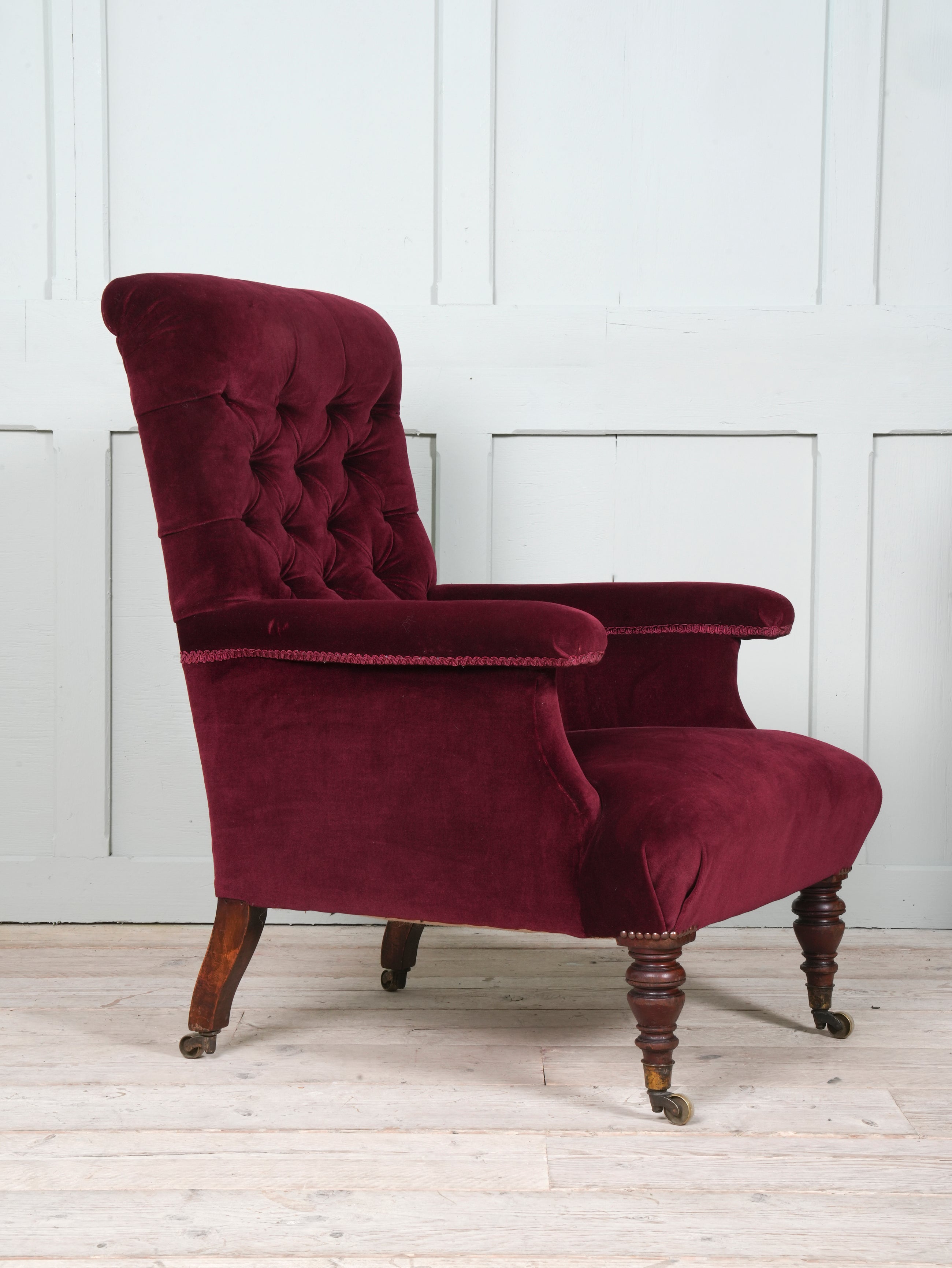 A Howard & Sons Buttoned Back Armchair
