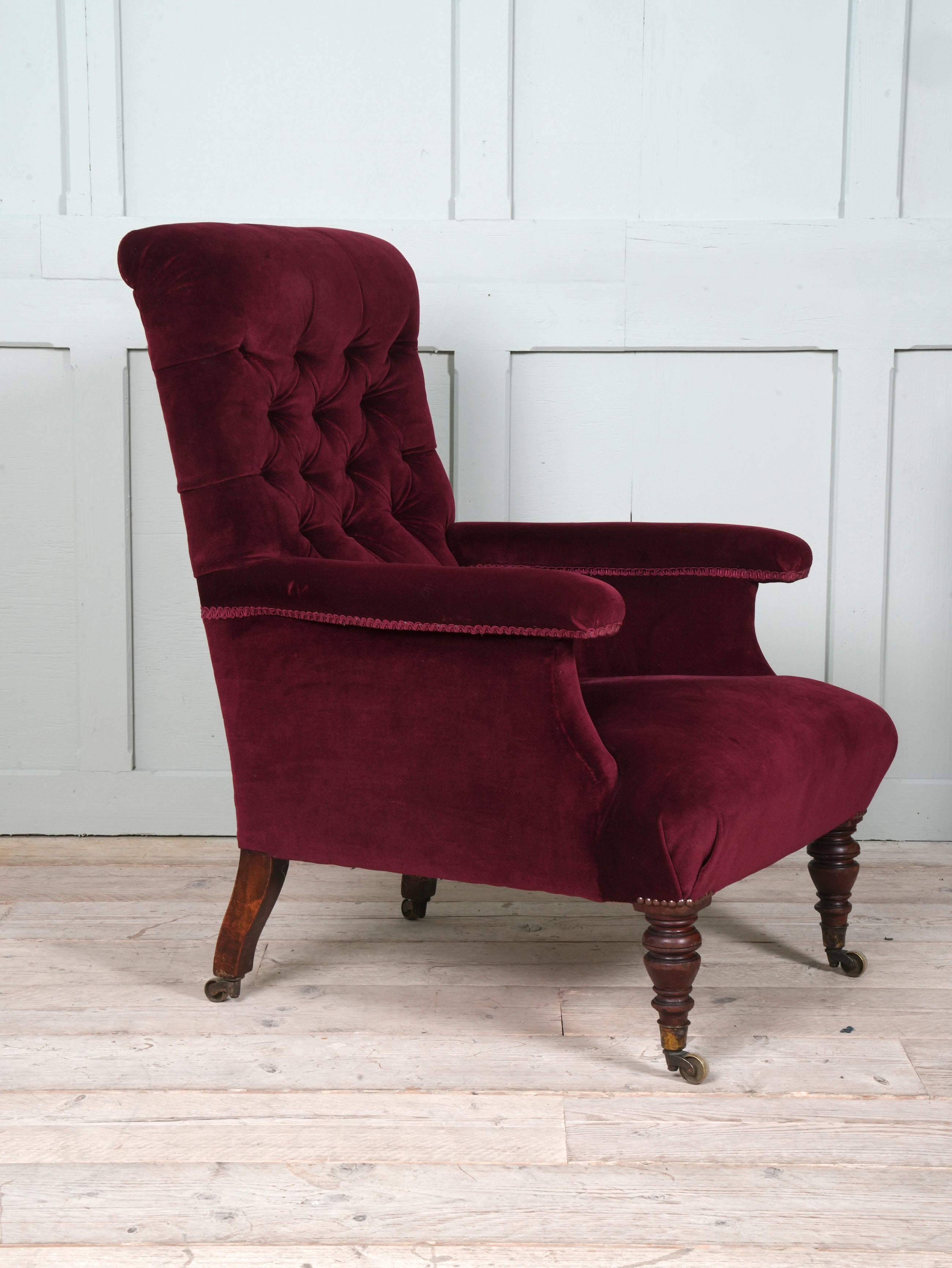 A Howard & Sons Buttoned Back Armchair