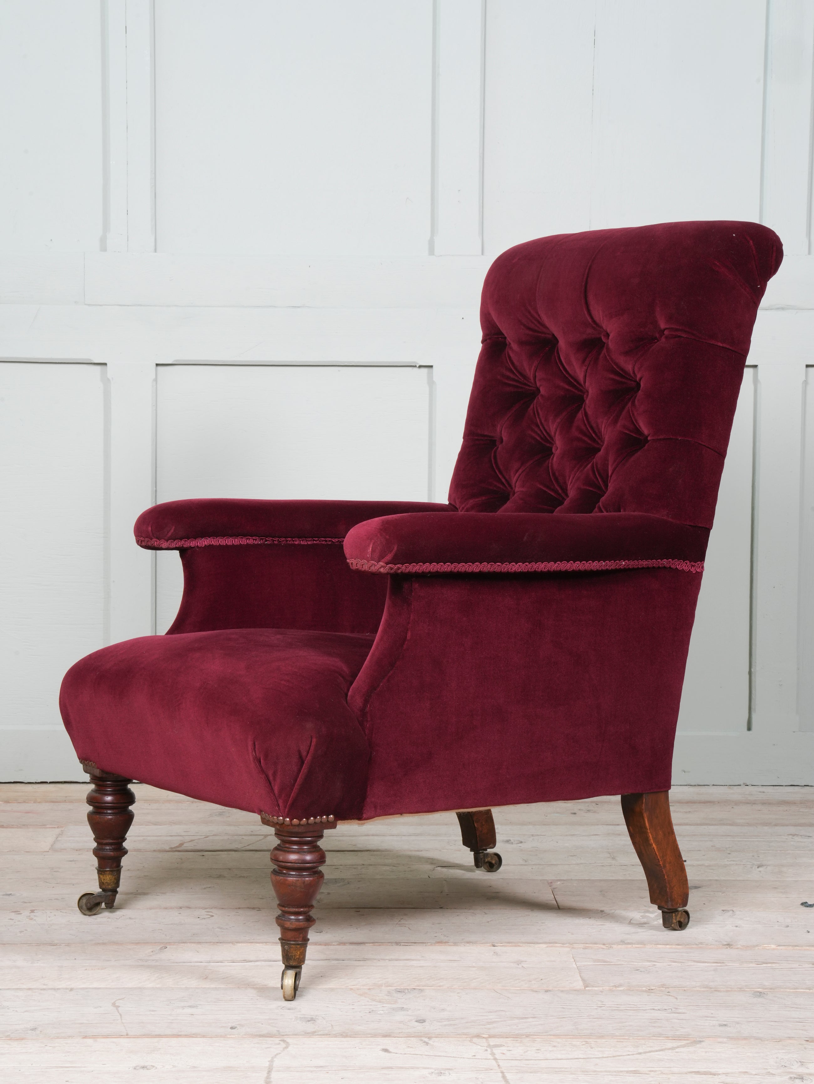 A Howard & Sons Buttoned Back Armchair