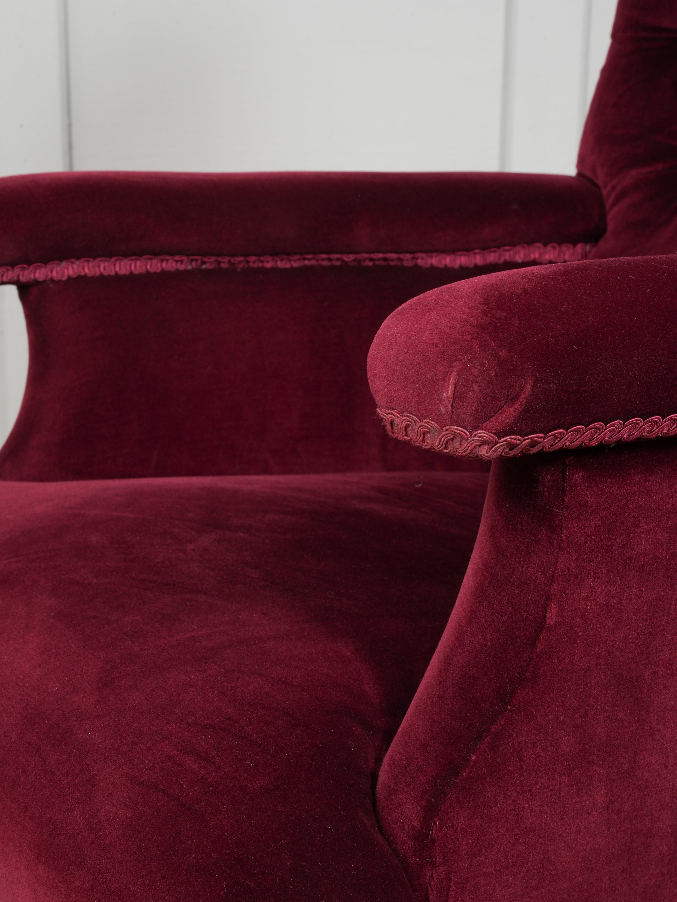 A Howard & Sons Buttoned Back Armchair