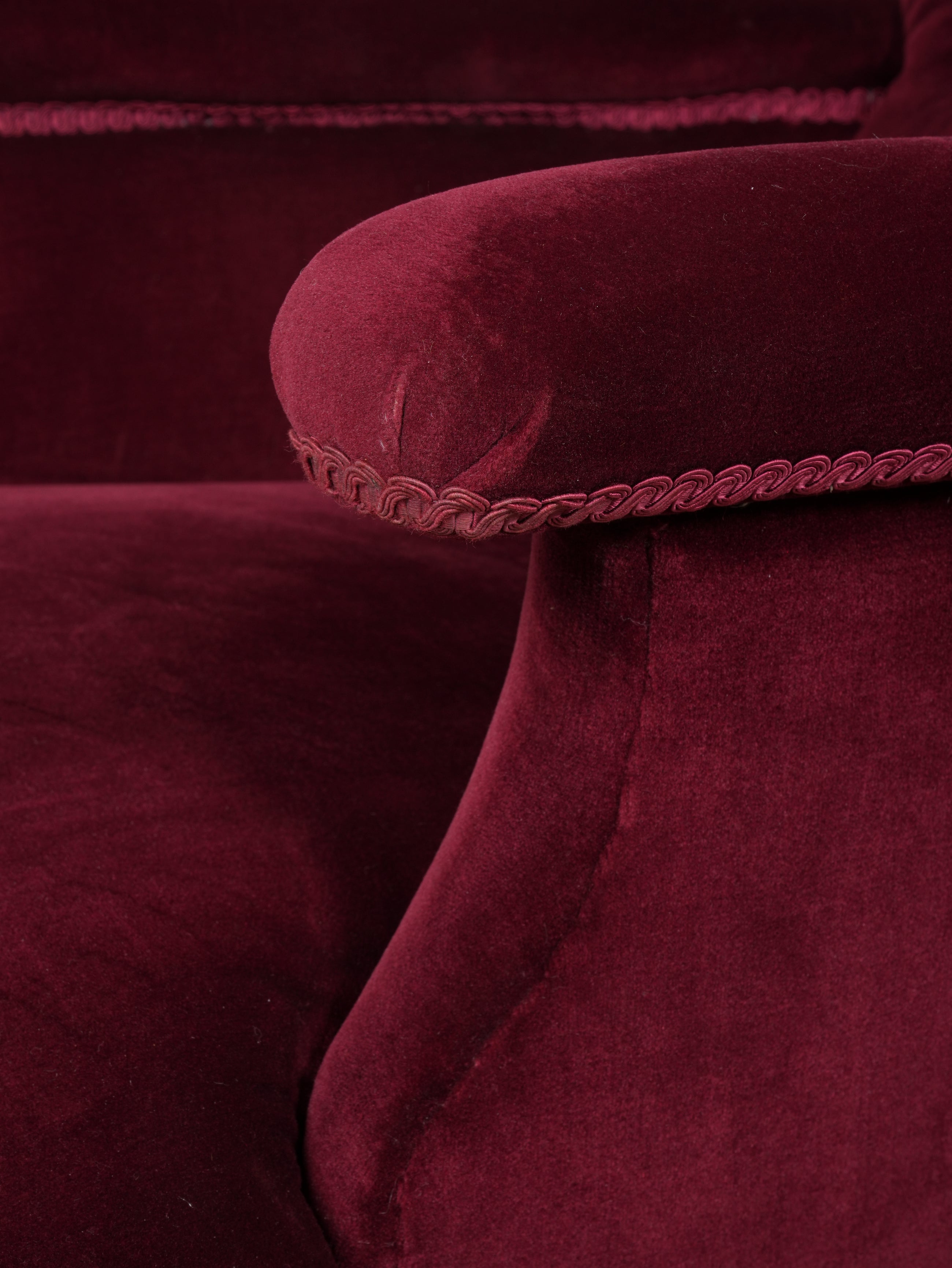 A Howard & Sons Buttoned Back Armchair