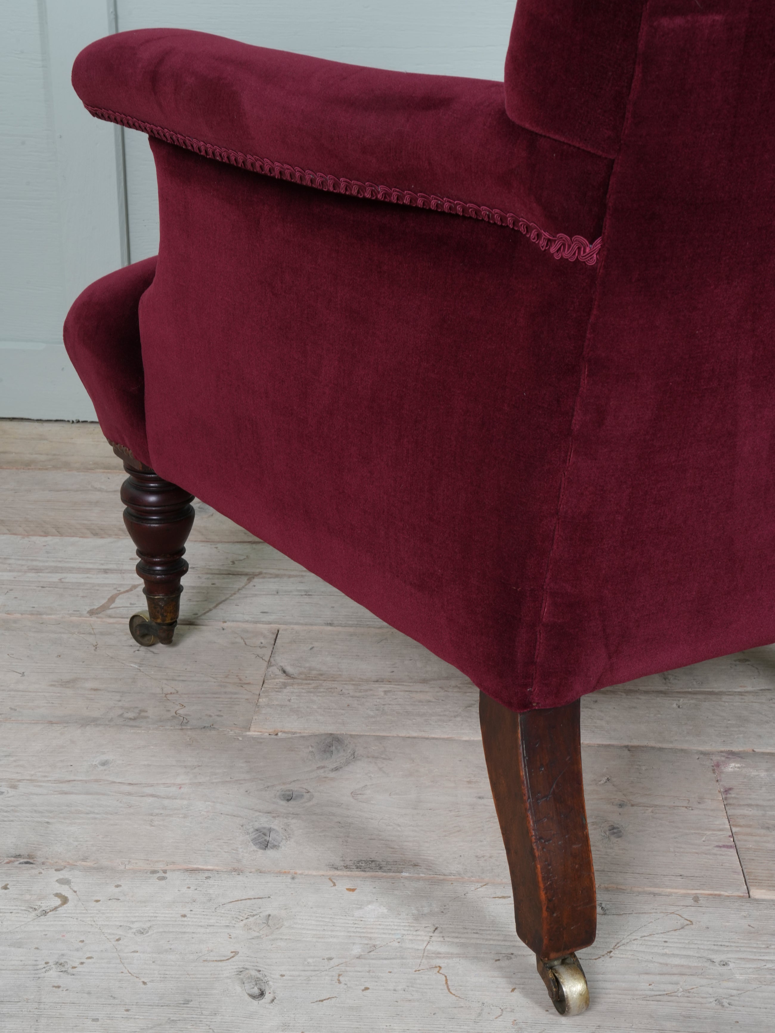 A Howard & Sons Buttoned Back Armchair