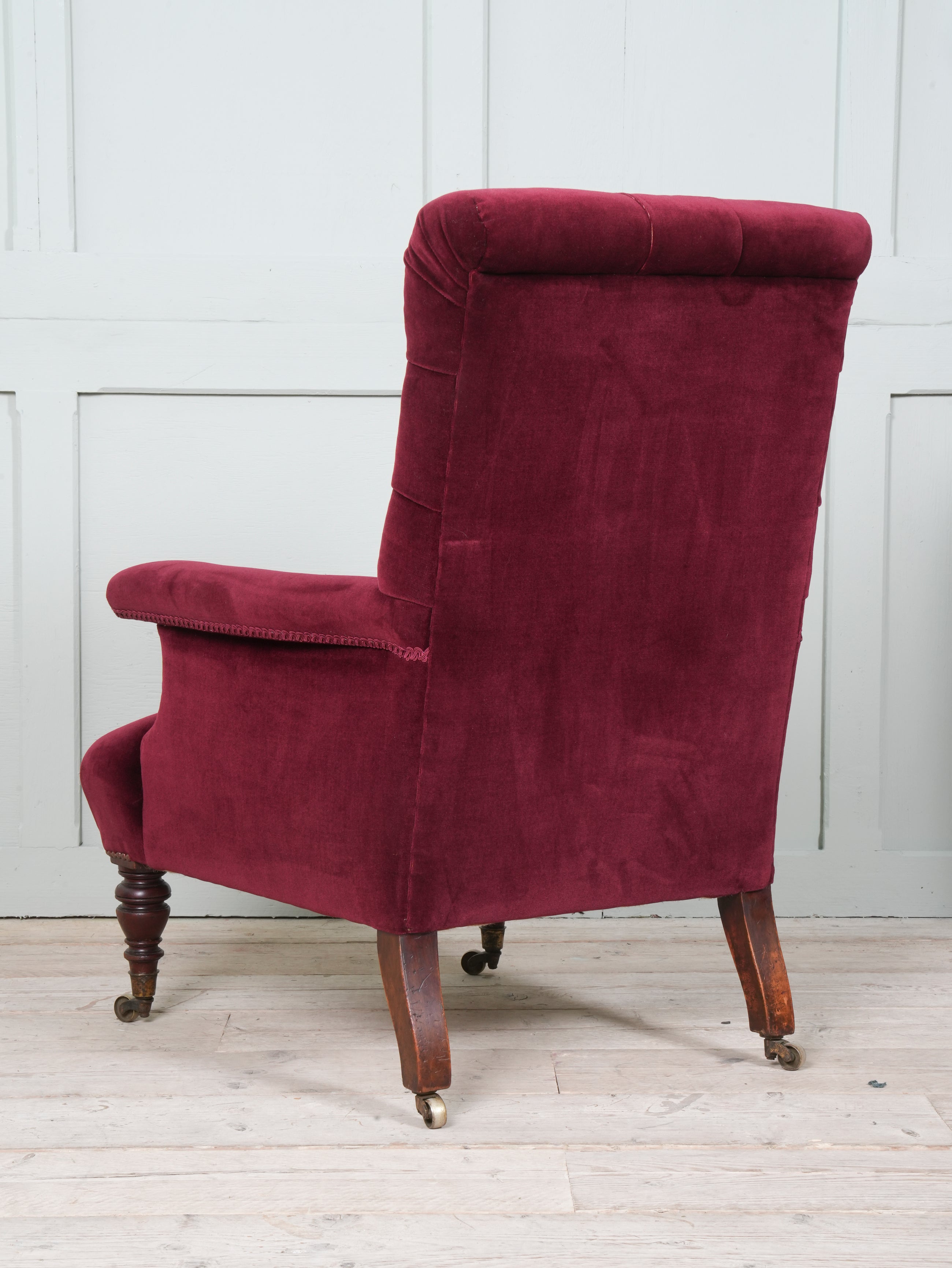 A Howard & Sons Buttoned Back Armchair
