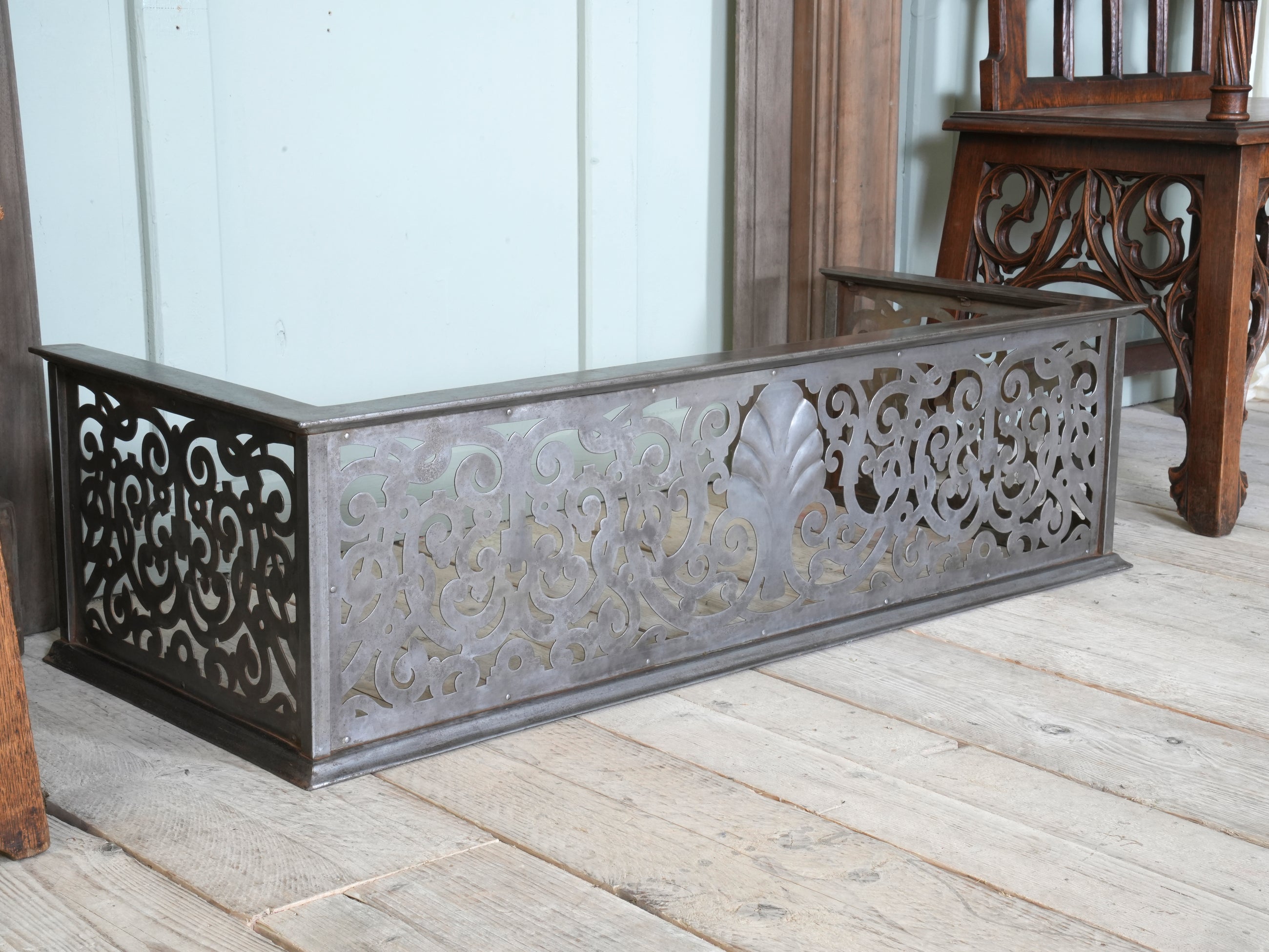 An Edwardian Pierced Steel Fireplace Fender