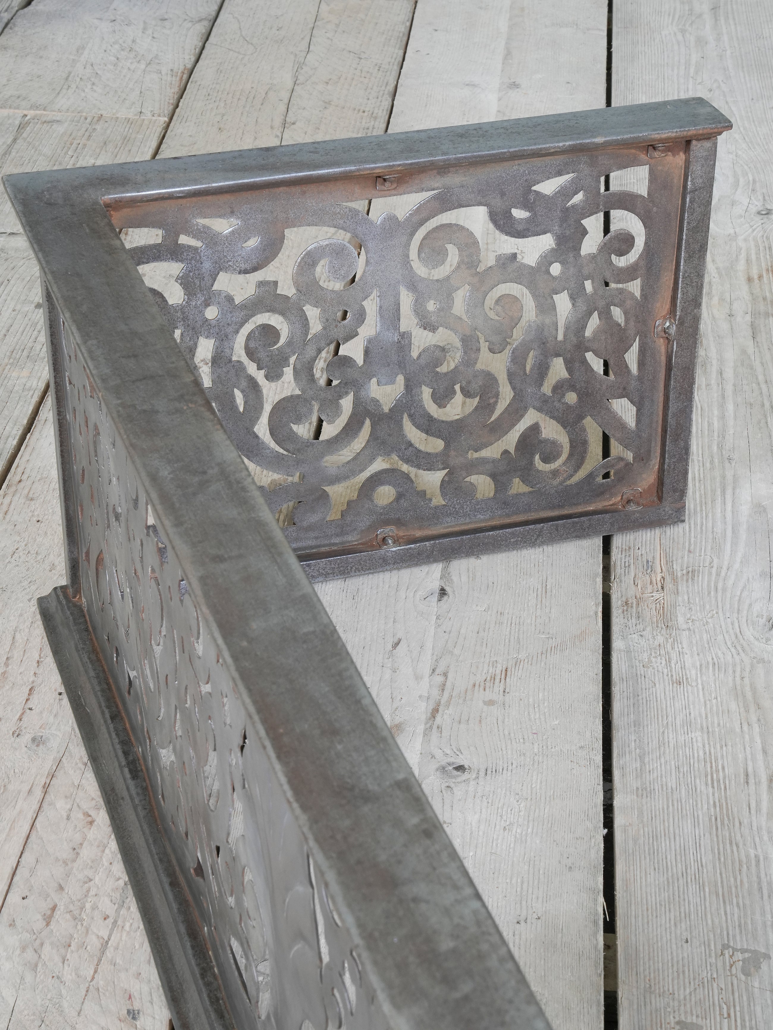 An Edwardian Pierced Steel Fireplace Fender