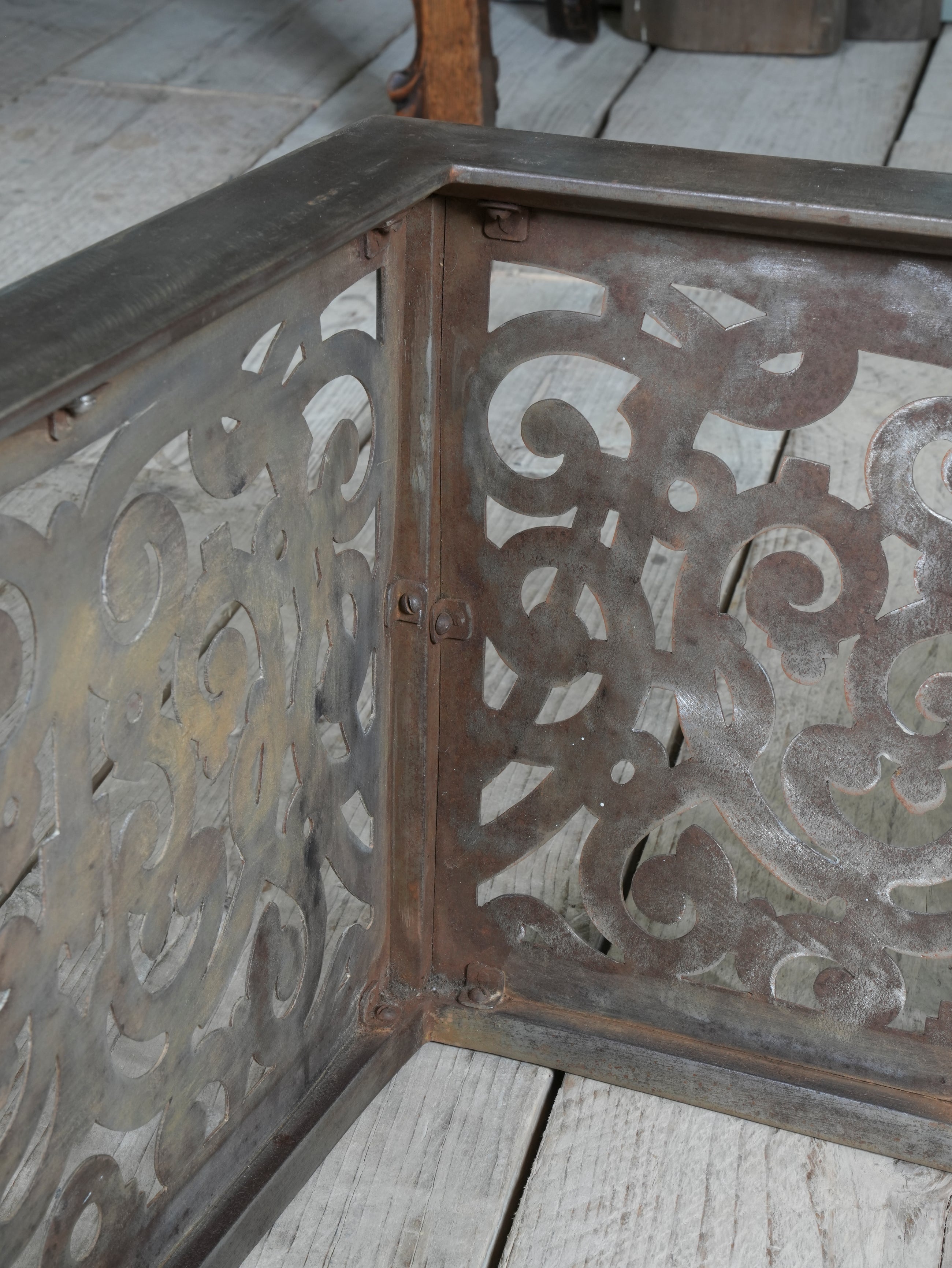 An Edwardian Pierced Steel Fireplace Fender