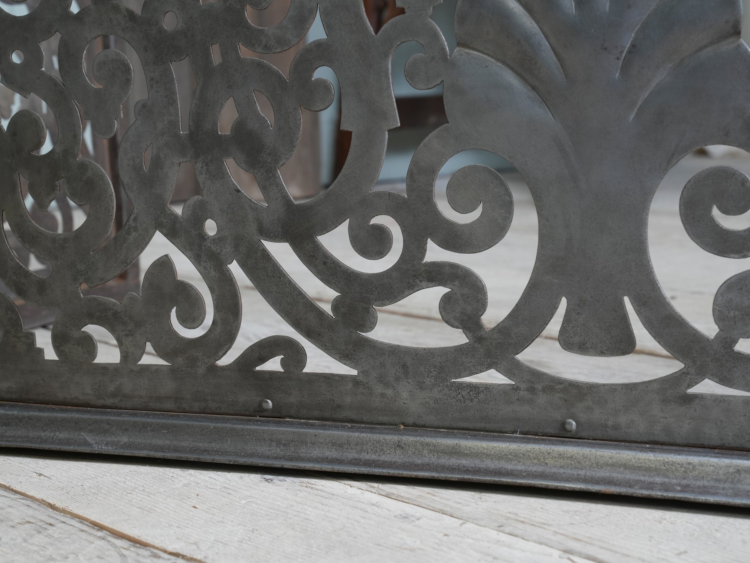An Edwardian Pierced Steel Fireplace Fender
