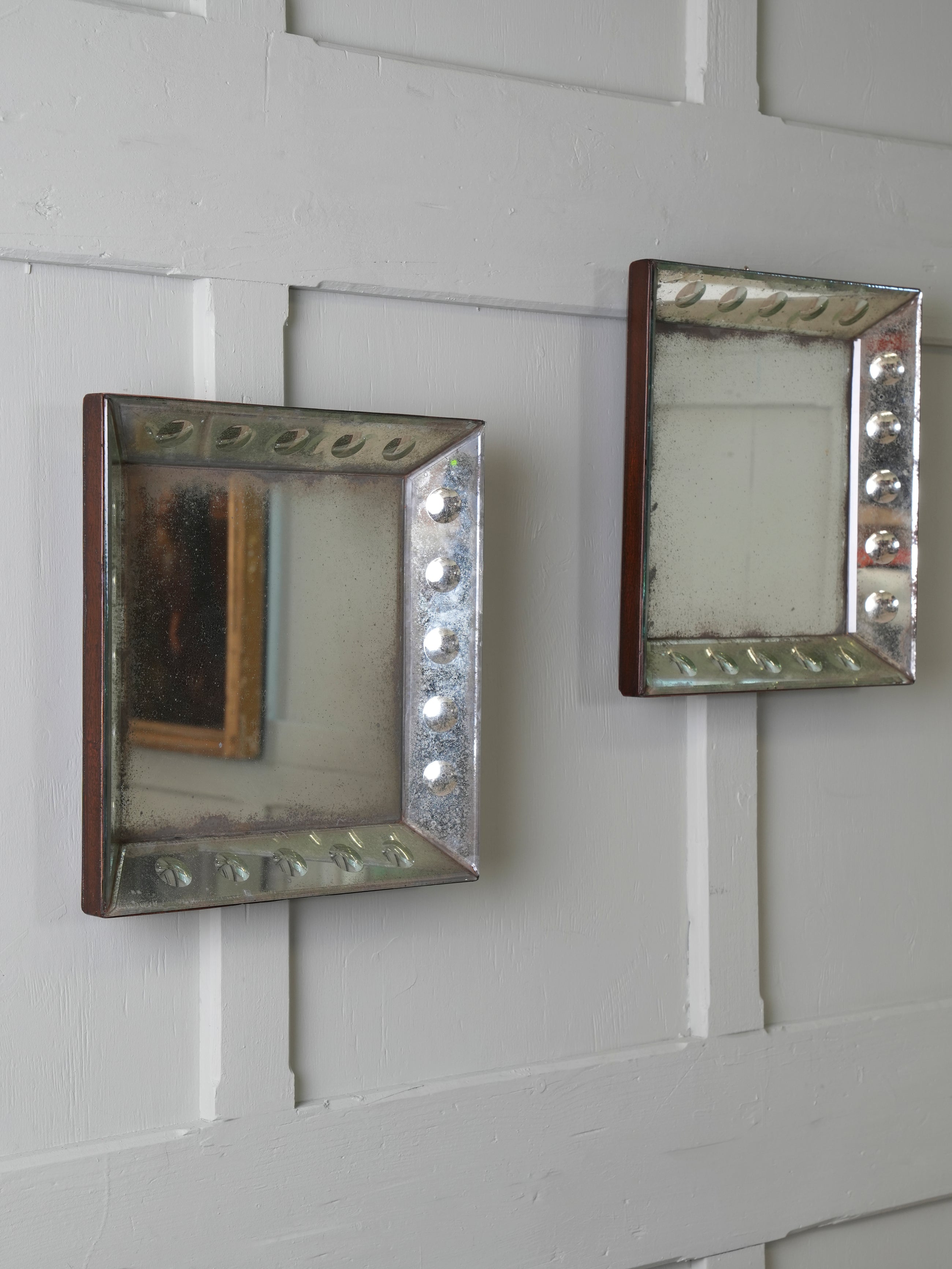 A Pair of Bevelled Wall Mirrors