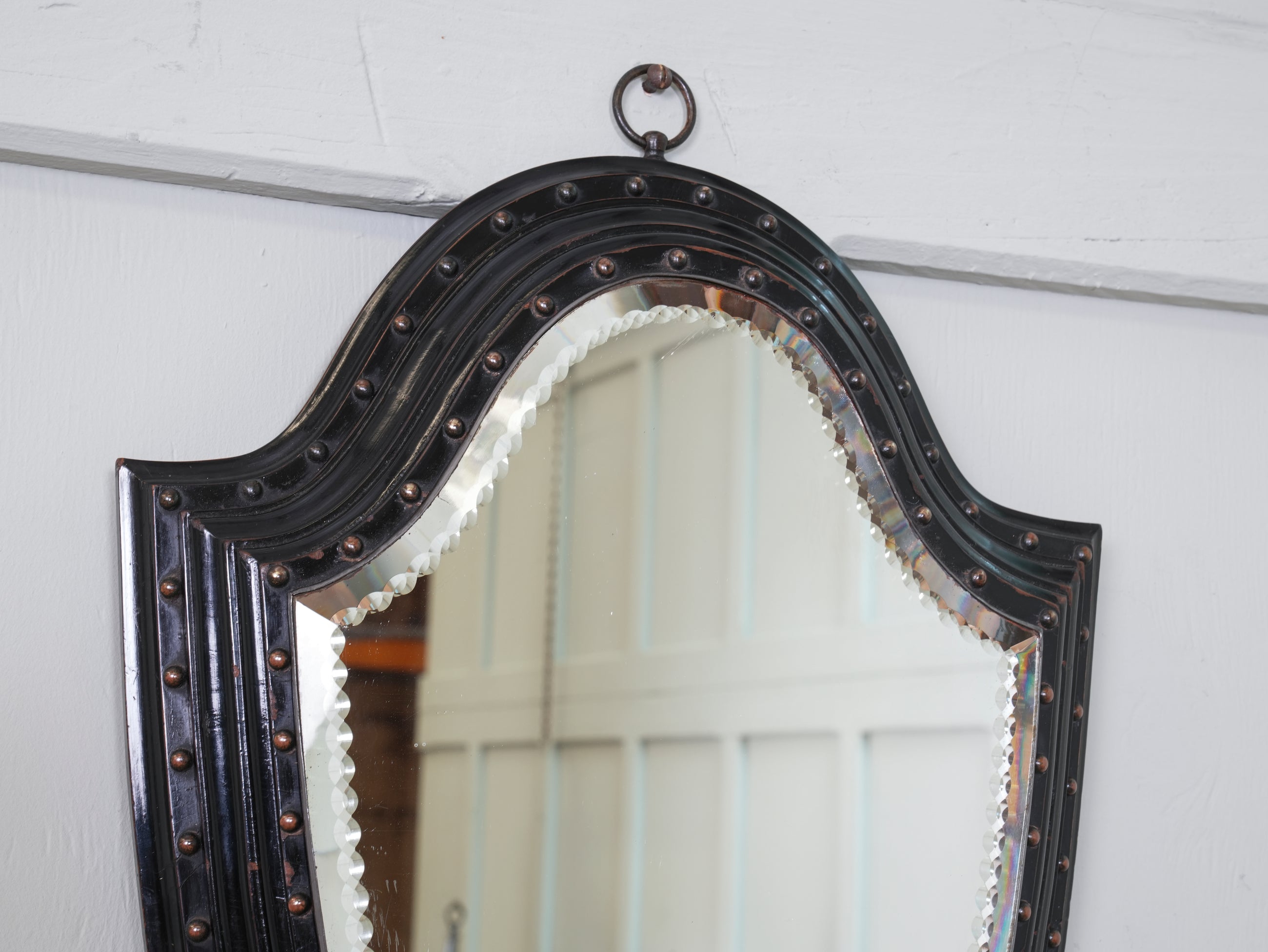 An Ebonised & Brilliant Cut Shield Mirror