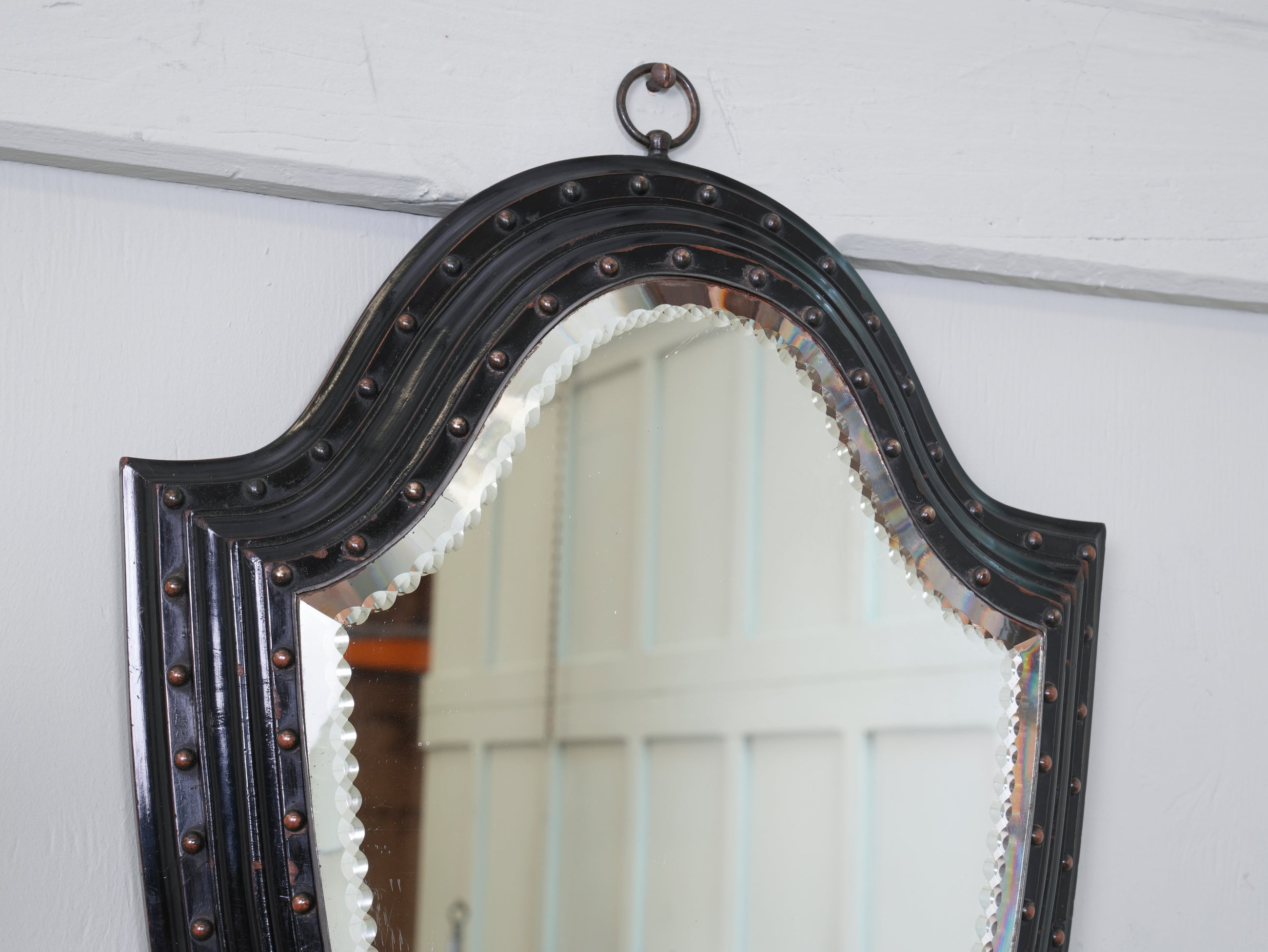 An Ebonised & Brilliant Cut Shield Mirror