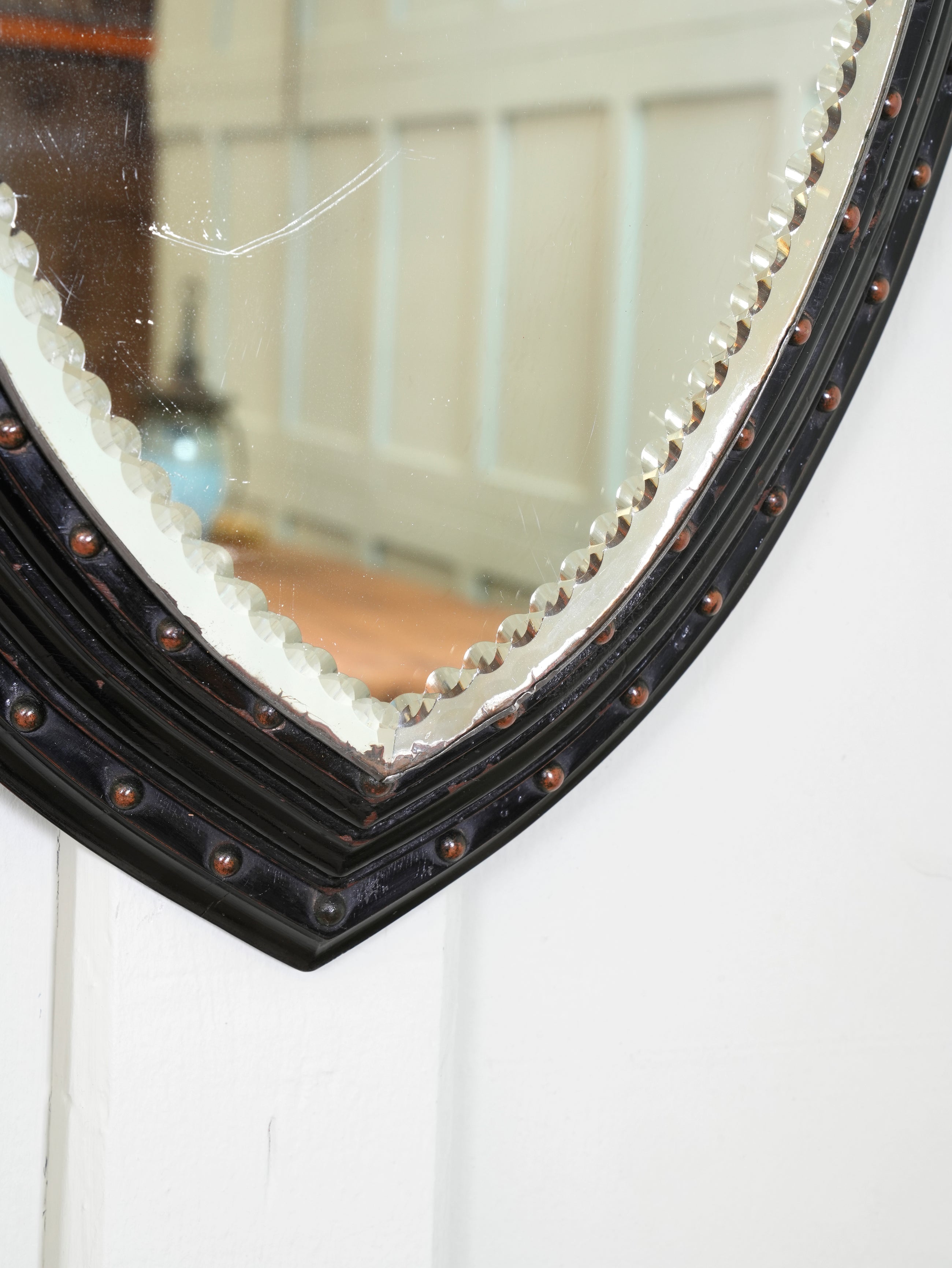 An Ebonised & Brilliant Cut Shield Mirror
