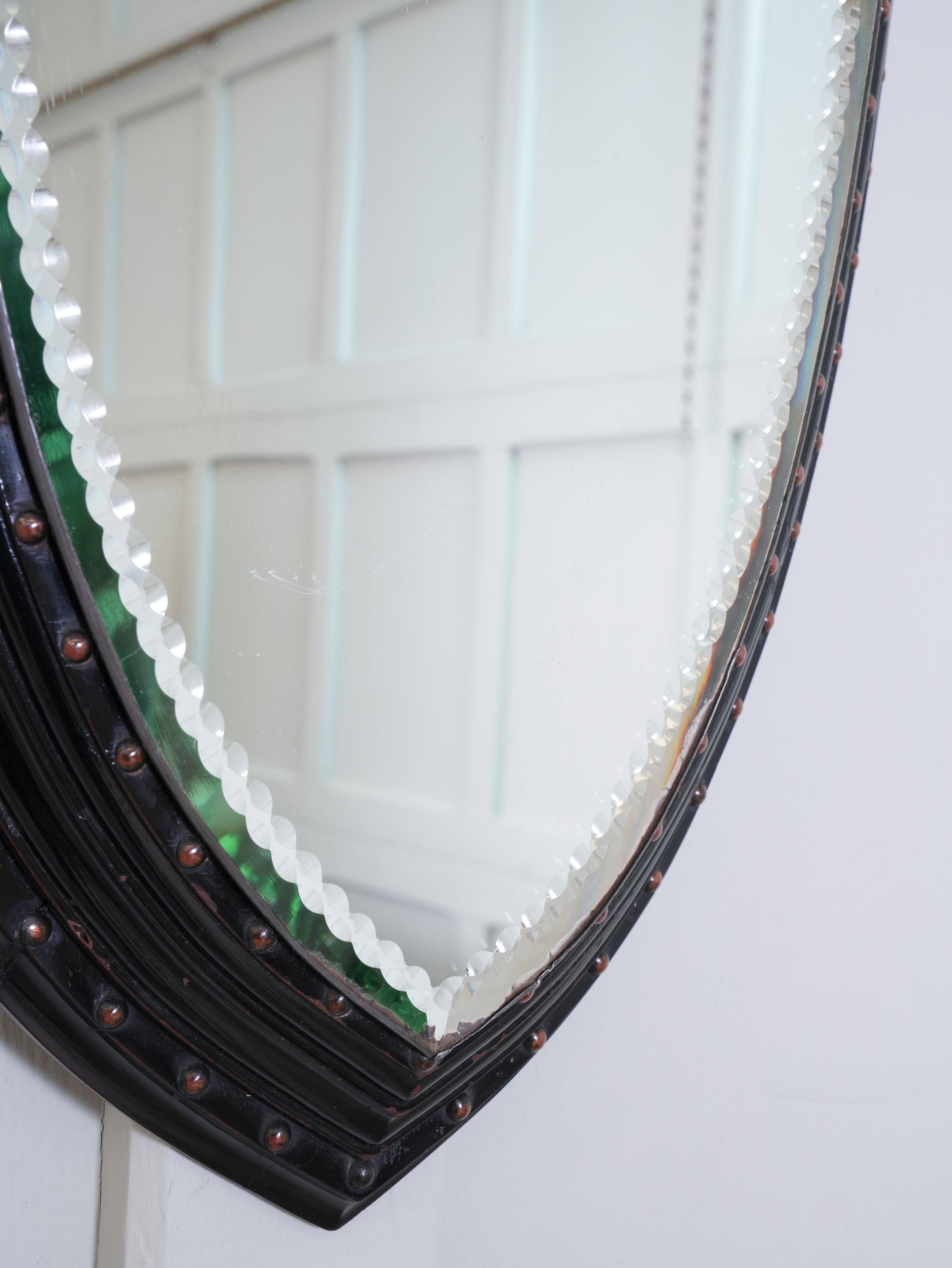An Ebonised & Brilliant Cut Shield Mirror