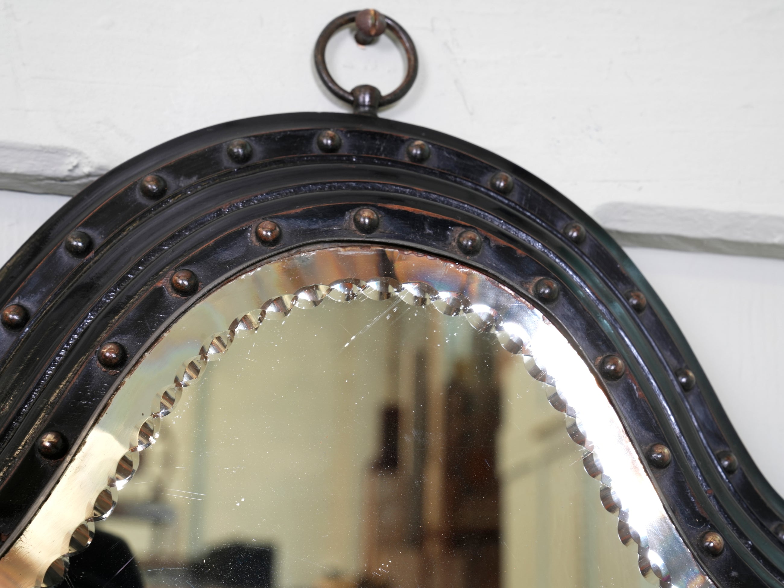An Ebonised & Brilliant Cut Shield Mirror