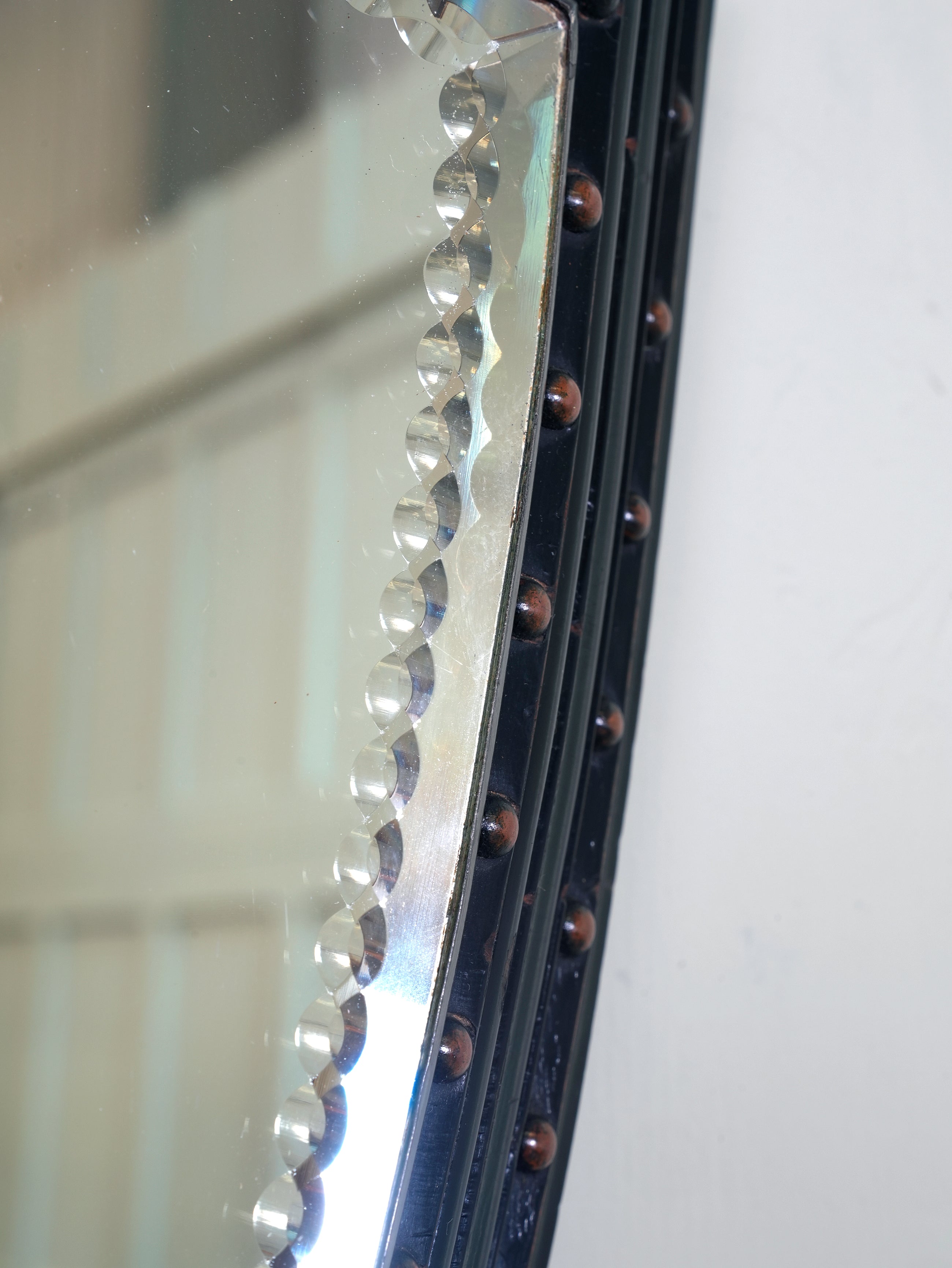 An Ebonised & Brilliant Cut Shield Mirror