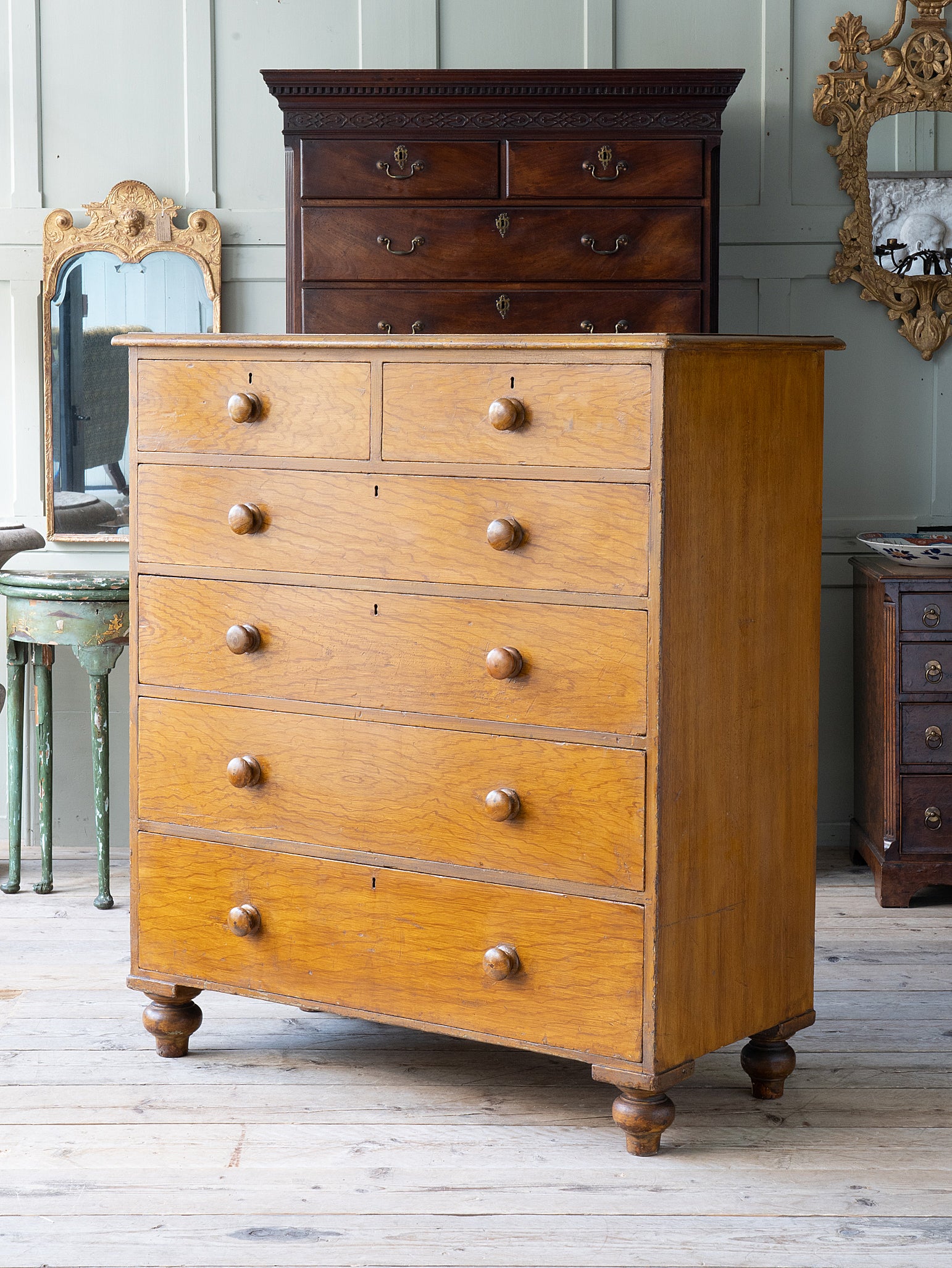 A Faux Oak Decorated Chest of Drawers