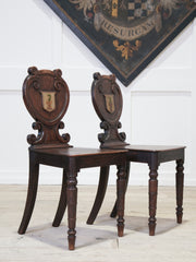 A Pair of 19th Century Oak Armorial Hall Chairs