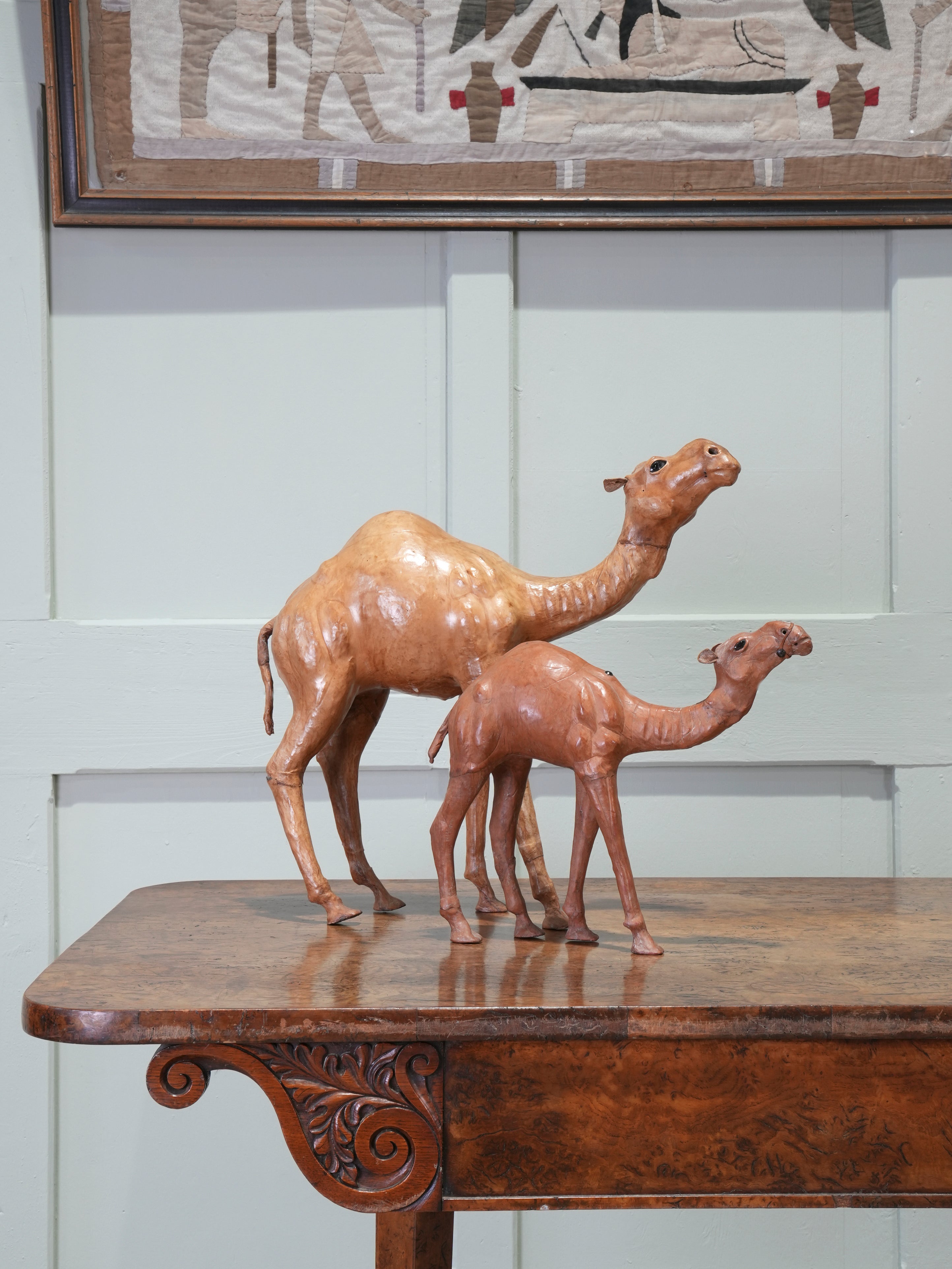 A Pair of Leather Table Camels