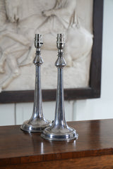 A Pair of Silvered Table Lamps