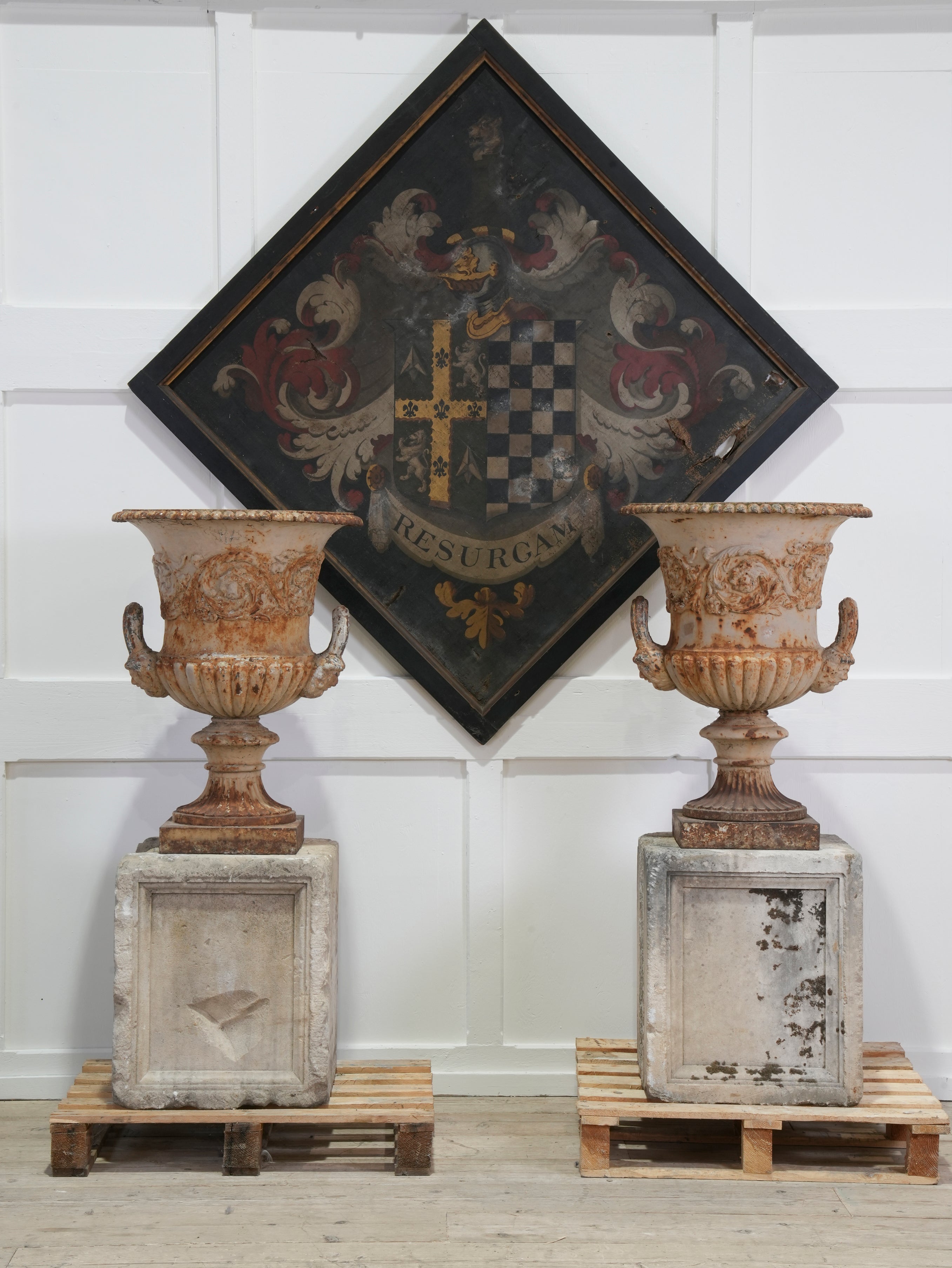 A Pair of Handyside Urns on Stone Pedestals