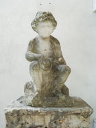 An 18th Century Limestone Putti on a Caen Stone Pillar