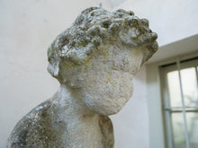 An 18th Century Limestone Putti on a Caen Stone Pillar