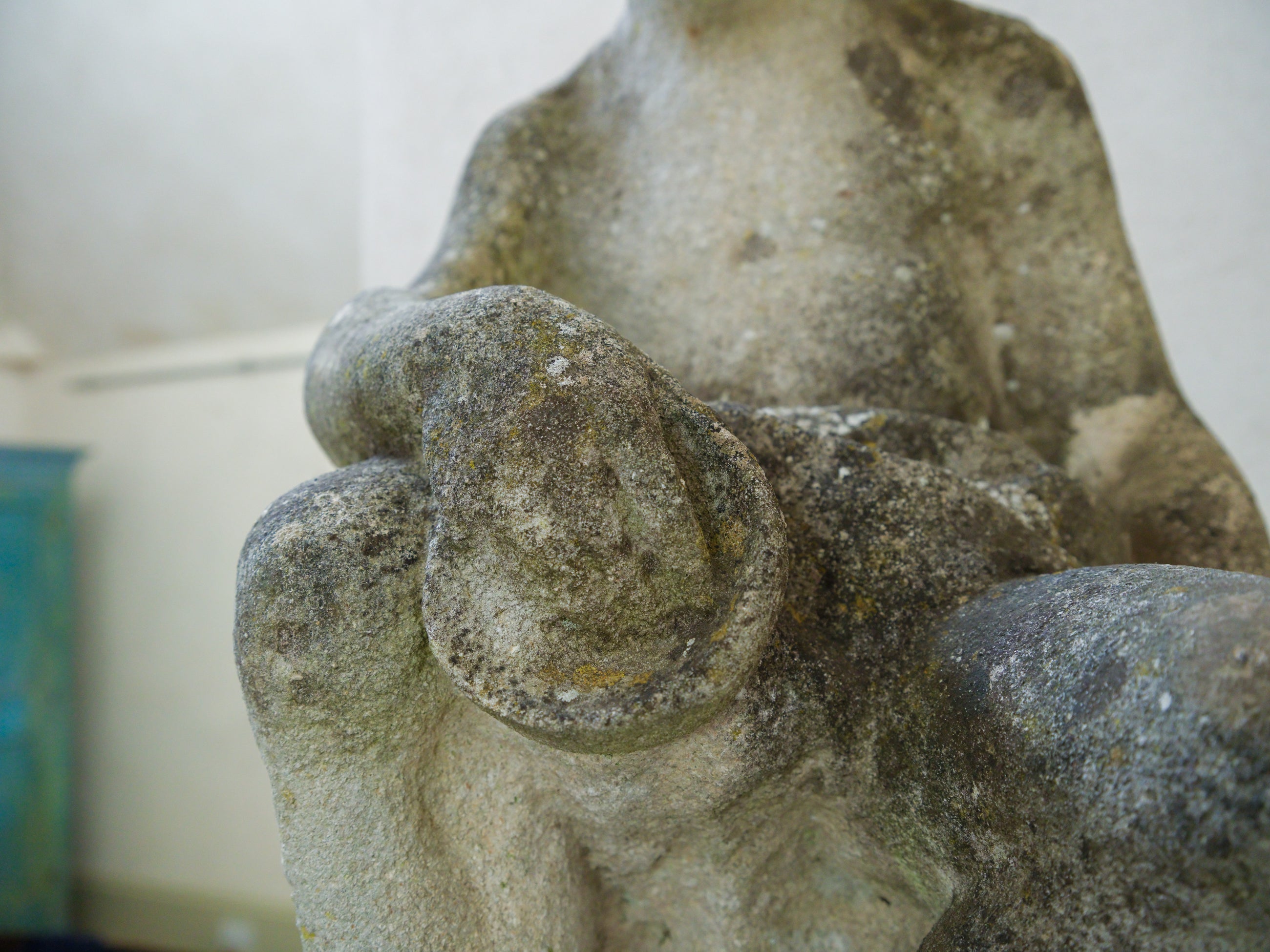 An 18th Century Limestone Putti on a Caen Stone Pillar