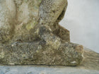 An 18th Century Limestone Putti on a Caen Stone Pillar