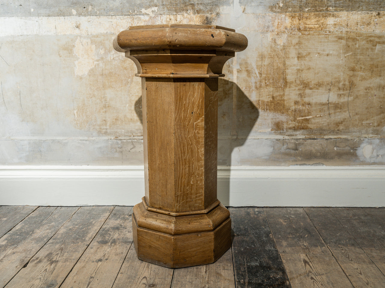 A Faux Oak decorated Column Plinth