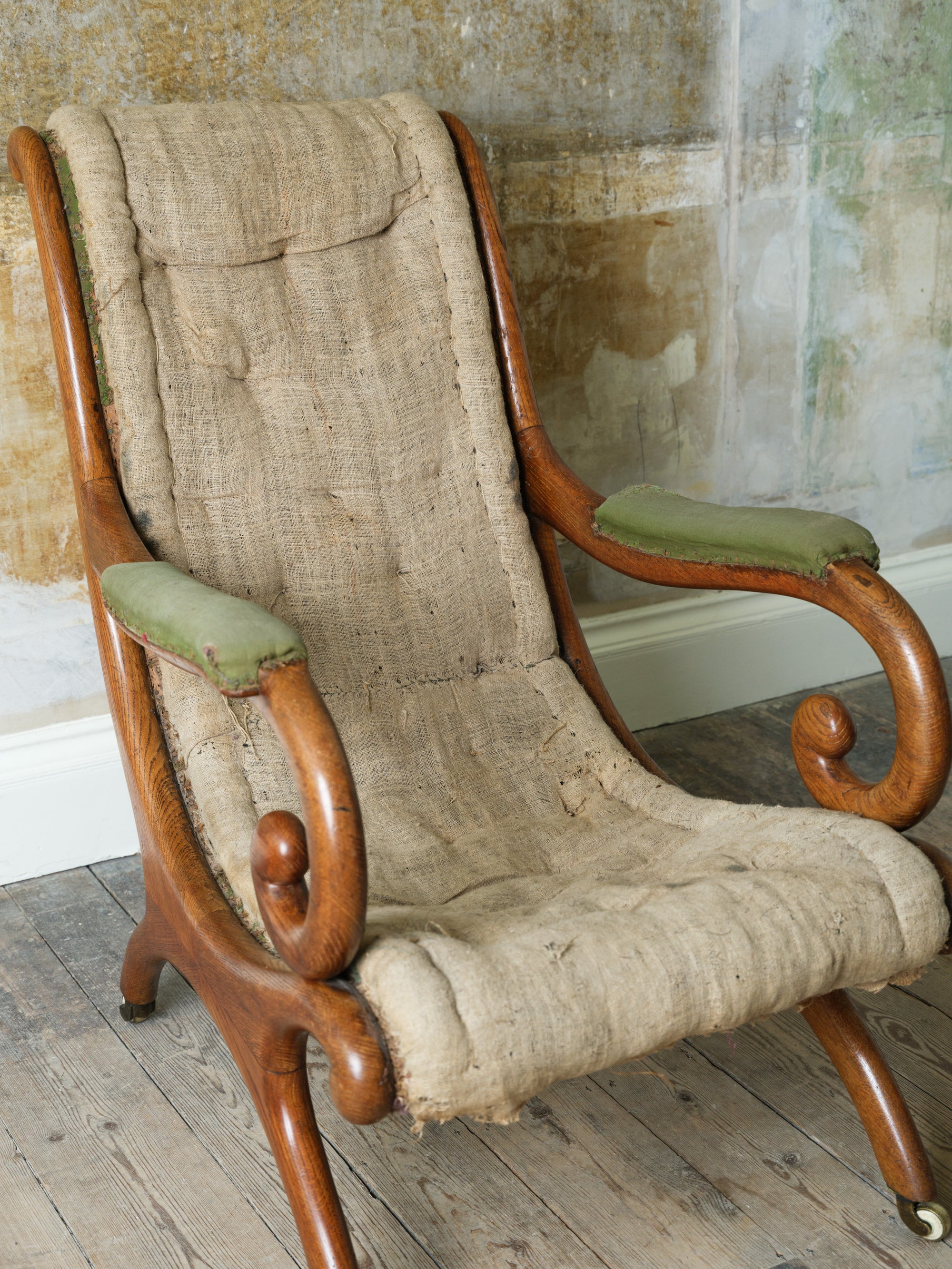 A 19th Century Upholstered Oak Armchair.