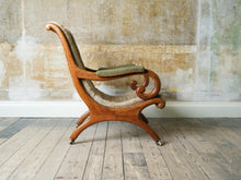 A 19th Century Upholstered Oak Armchair.