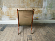 A 19th Century Upholstered Oak Armchair.