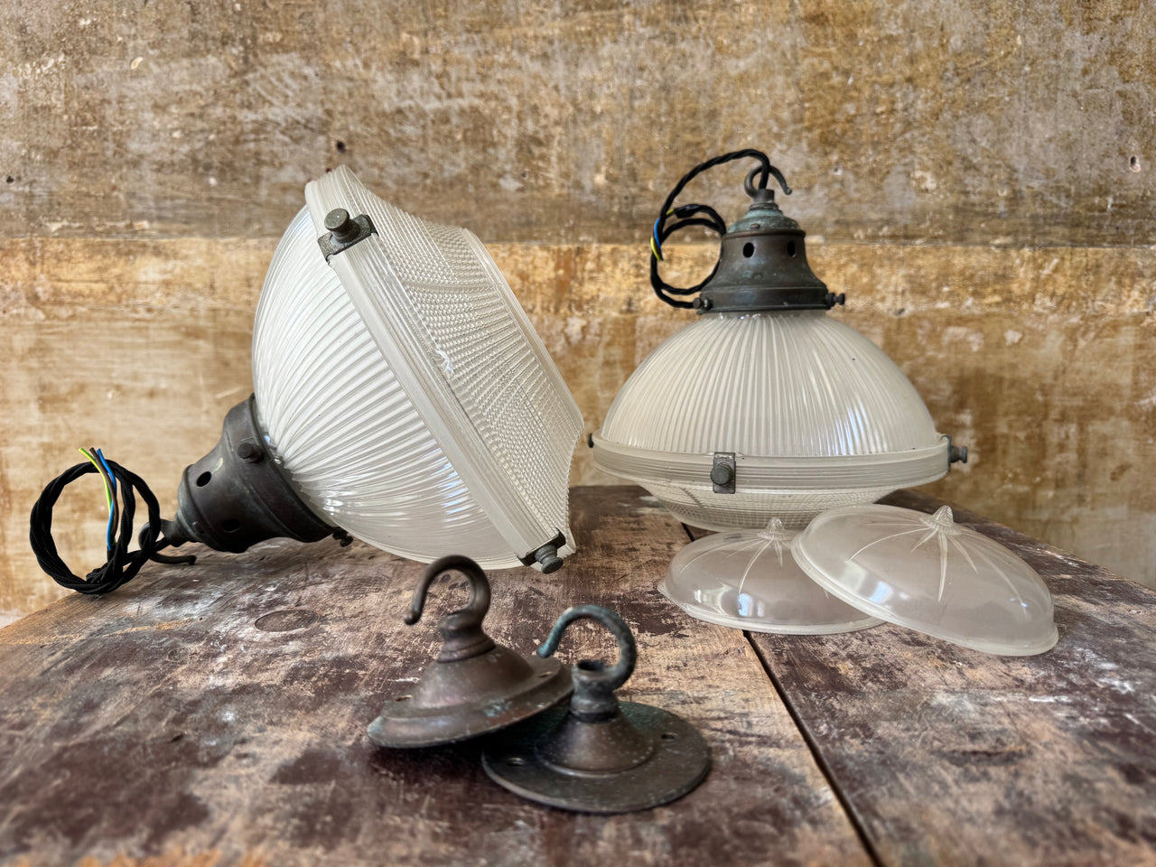A Pair of Holophane Pendant lights