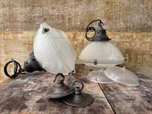 A Pair of Holophane Pendant lights