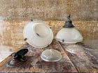 A Pair of Holophane Pendant lights