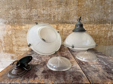 A Pair of Holophane Pendant lights