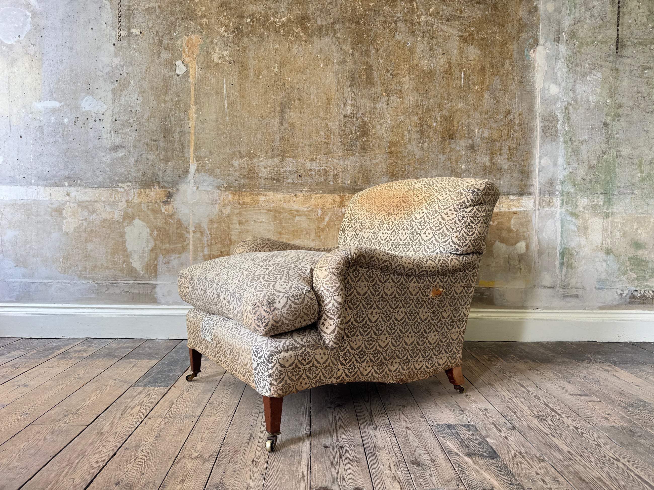 A late 19th Century Howard & Sons Harley Armchair