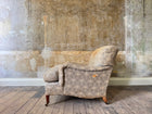 A late 19th Century Howard & Sons Harley Armchair