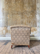 A late 19th Century Howard & Sons Harley Armchair