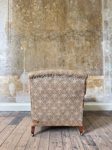 A late 19th Century Howard & Sons Harley Armchair